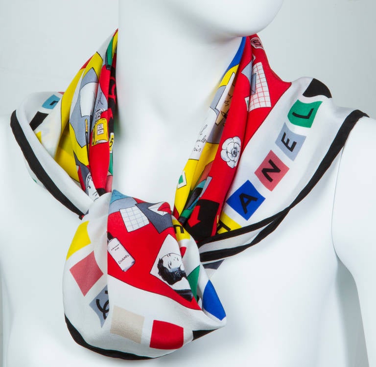 This is a colorful and unusual scarf. Letters and notes seemingly written by Chanel adorn the yellow, red and green field of this scarf.