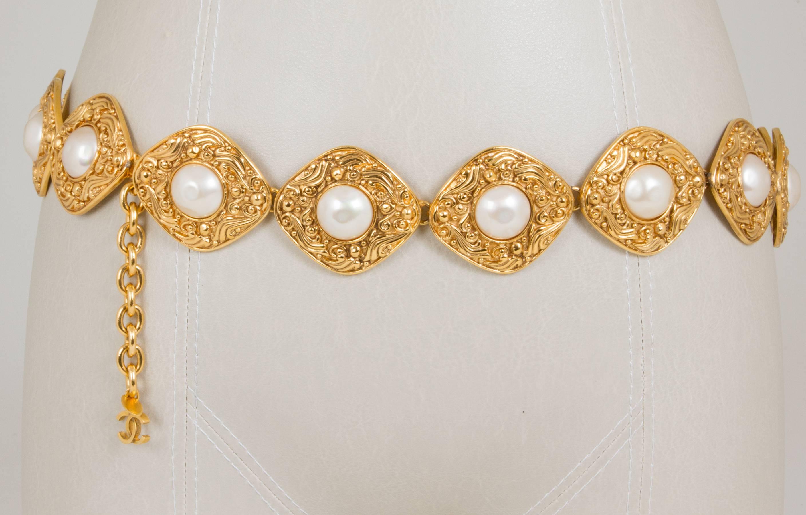 This belt can be also worn as a necklace.  The belt consists of gold plated rhombic elements that have  a delicate design on the face.  Each element is accented with a pearl.  The belt has a 3