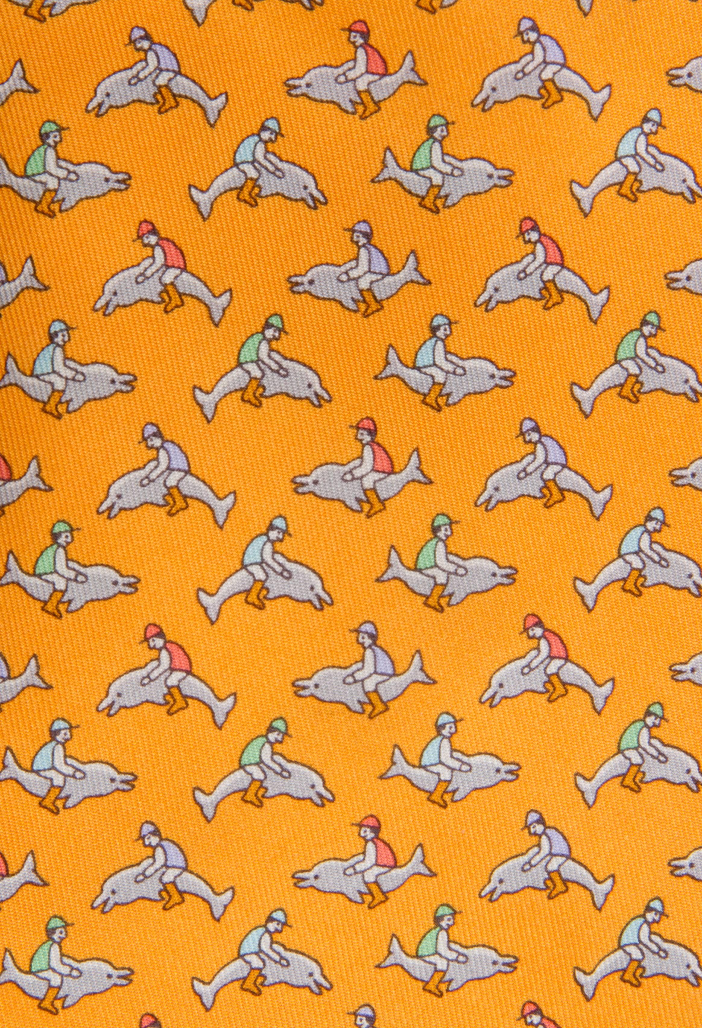 Jockeys sit atop dolphins on this whimsical tie.