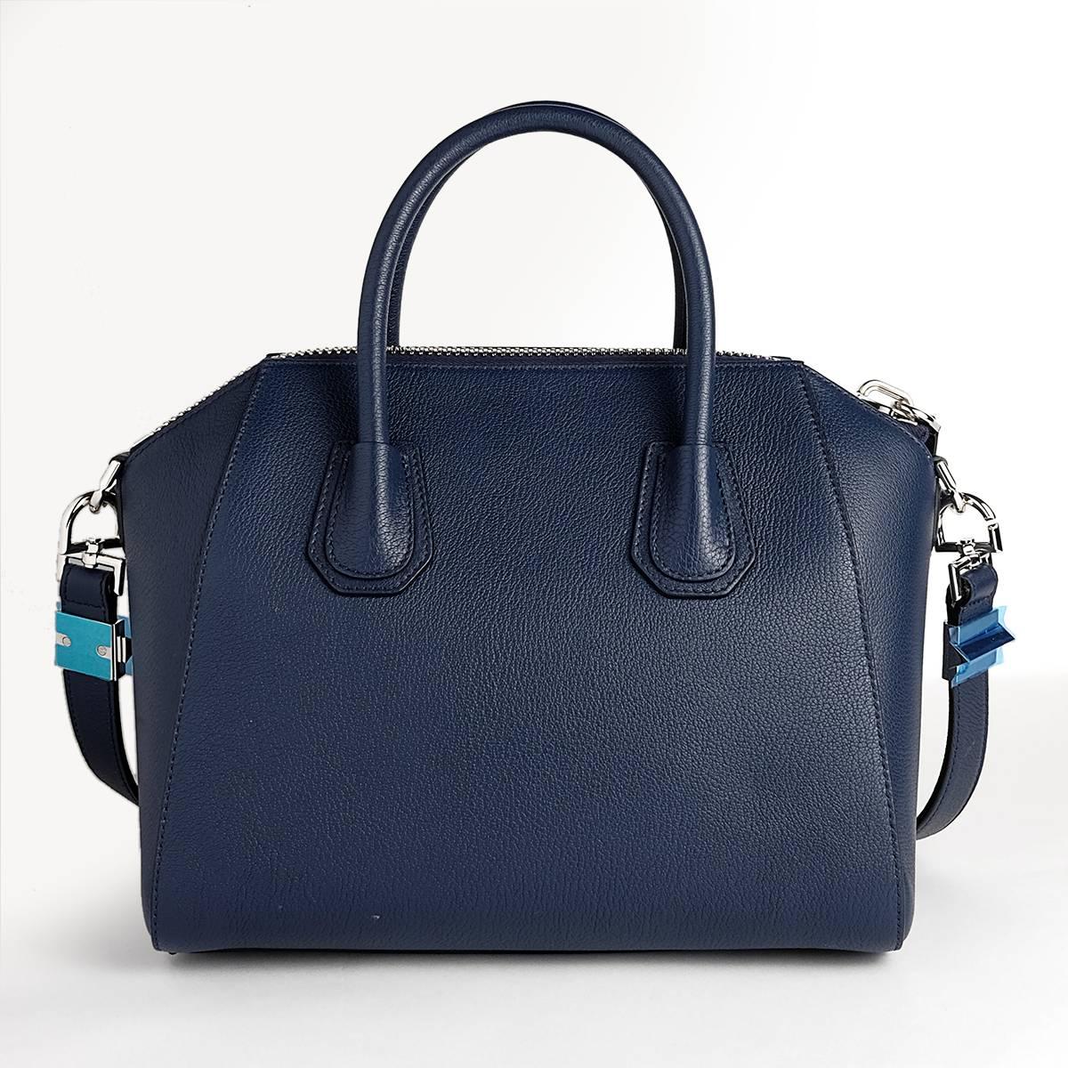 Small Antigona in Blue Goat leather with two handles and strap.
The bag has never been used and comes with original tags and dustbag.
