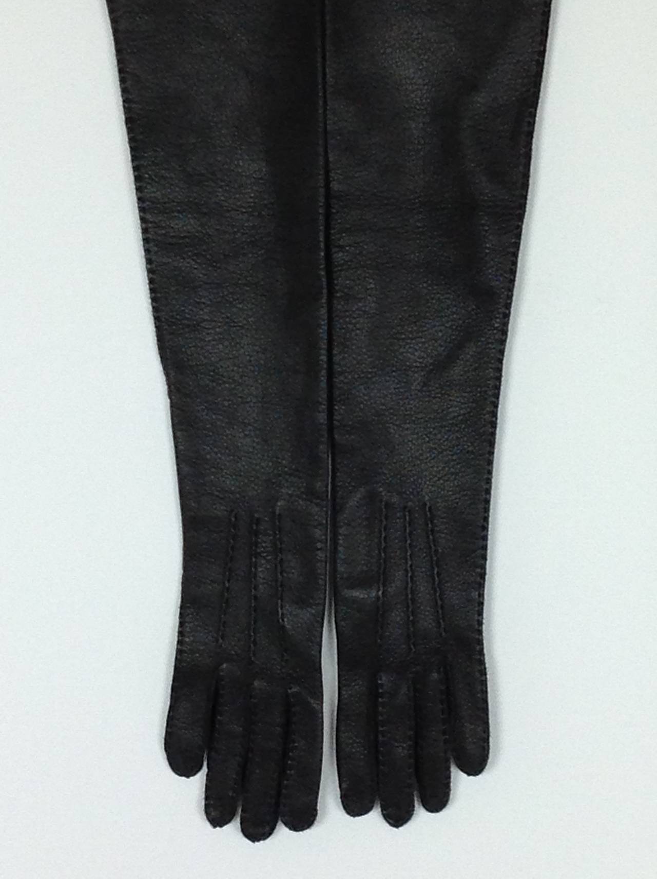 Sexy textured black leather Marni opera gloves.
Unlined buttery soft deerskin gloves.    
Handpicked stitching on the fingers and outside seam.
24