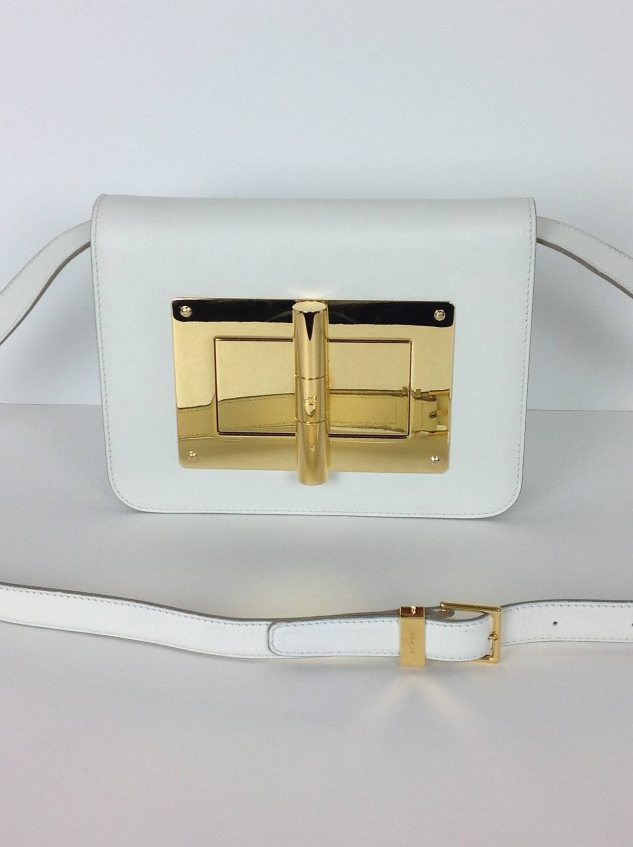 Natalia Bag by Tom Ford. Very Versitile-can be worn as a clutch or shoulder bag.
Grained kidskin leather with polished goldtone hardware.Flap front with logo engraved, oversized turn lock closure. Suede lined slit pocket on back.
8.25