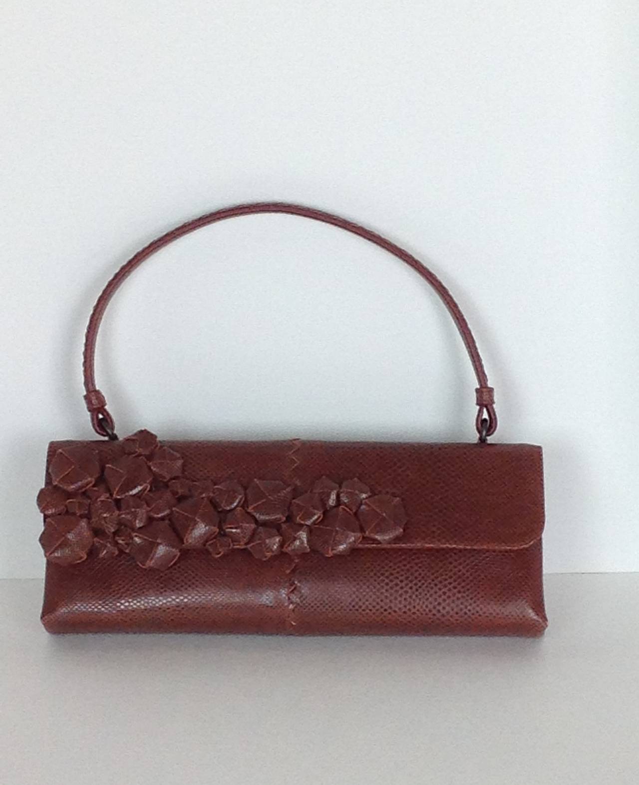 Cinnamon lizard Bottega Veneta handbag.
3D berries on the front, bunched together looks like floral branch-just lovely!
Classic BV woven handle with a 7.88