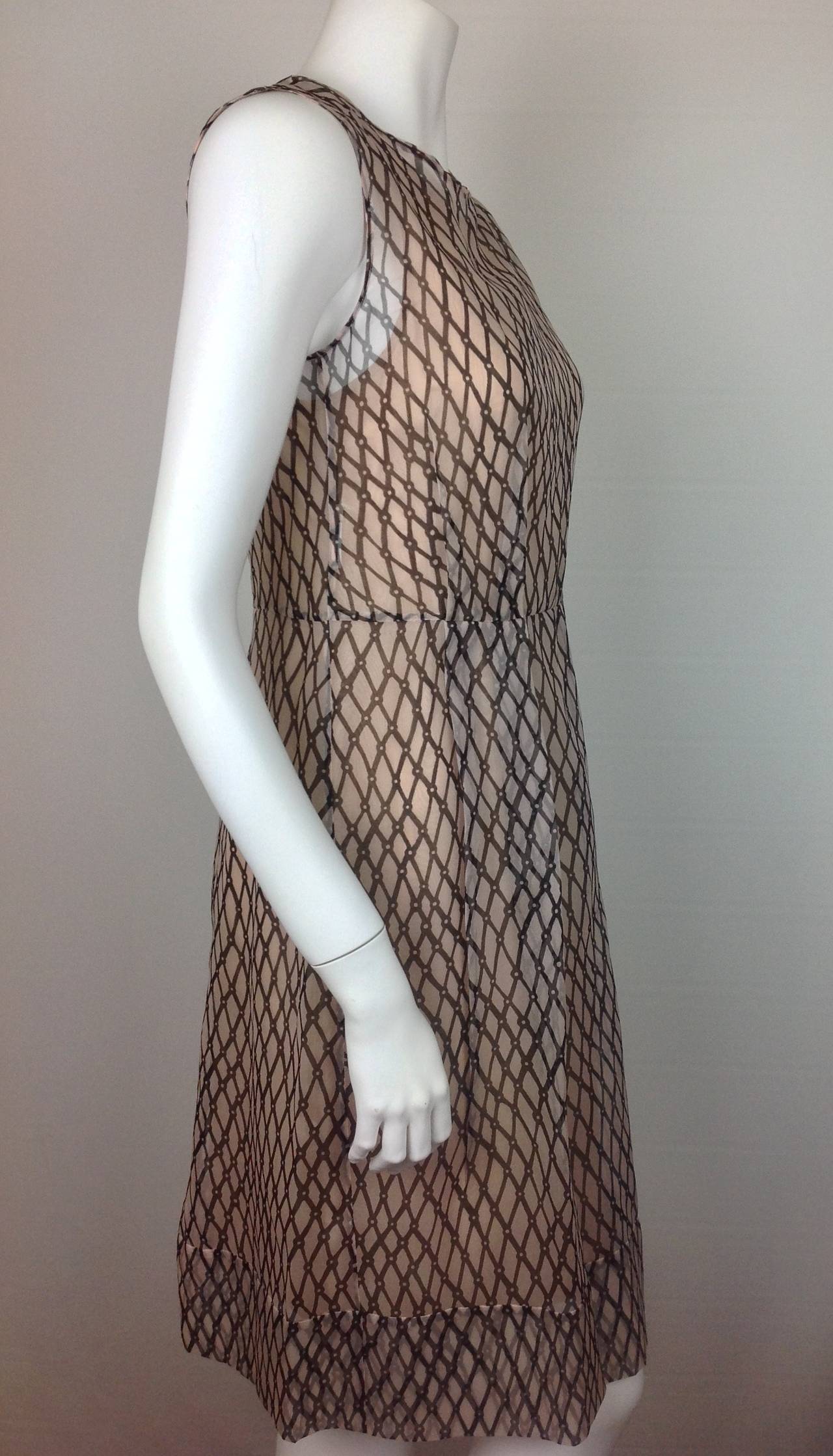 Marni sheer dress with flesh colored liner.  Graphic print on beige sheer fabric.
Flesh colored silk liner underneath.  19