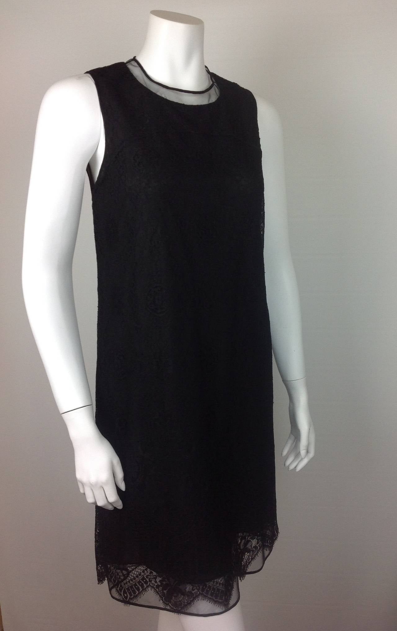 Gorgeous featherweight black lace sheath dress by Ralph Rucci.
Signature tulle at the neckline, and hemline. Beautifully made..
Lightweight silk lace, backed with signature tulle.  Lined in one layer of black silk, and two layers of nude silk -