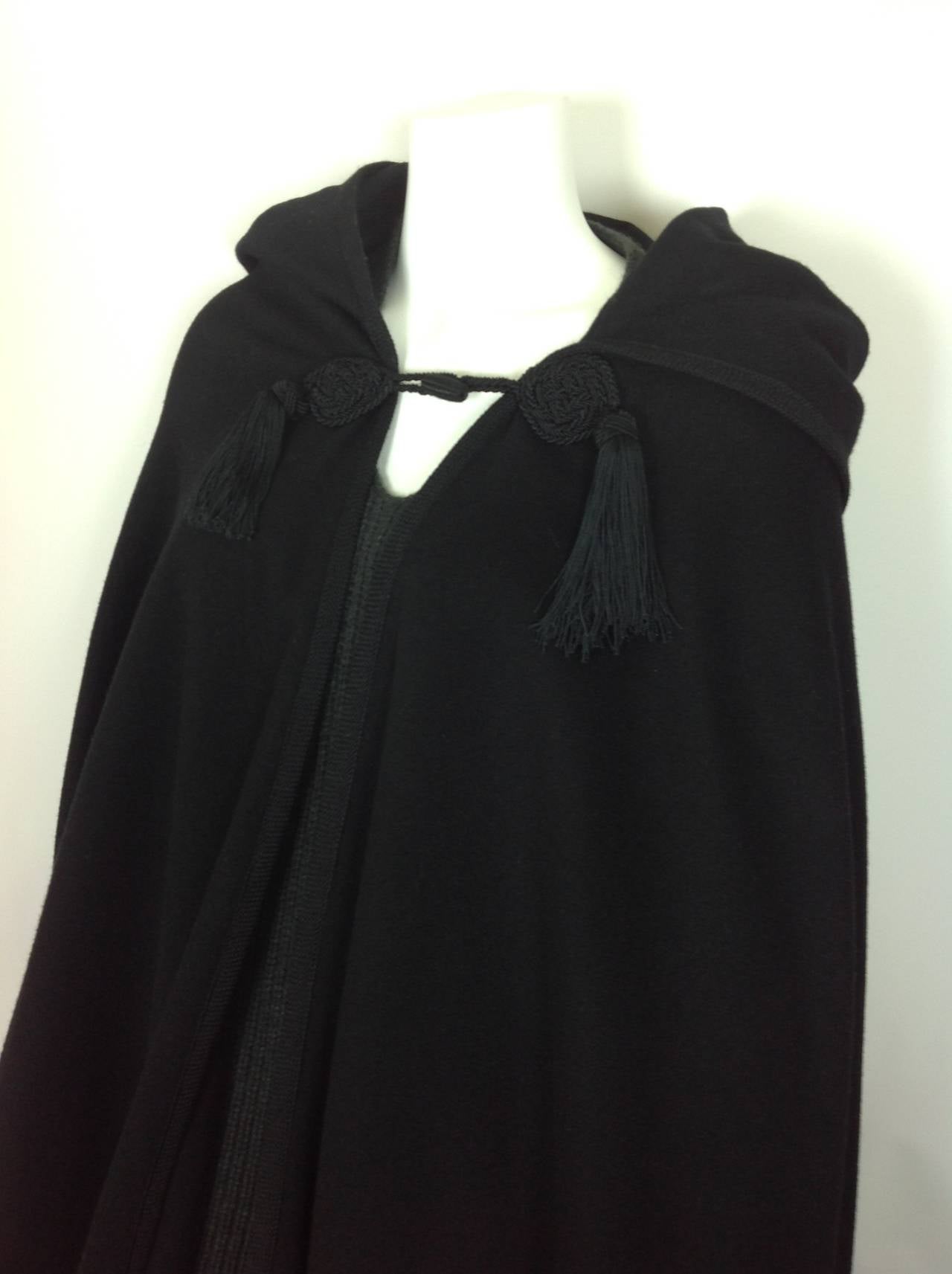 A real treat from the 1970's-a floor length black wool cape-from Yves St Laurent.
From the Russian Collection, with a  Saint Laurent Rive Gauche label!
Unlined, with a toggle (silk),secured by a soutach medallion on each side.  A 4 1/2