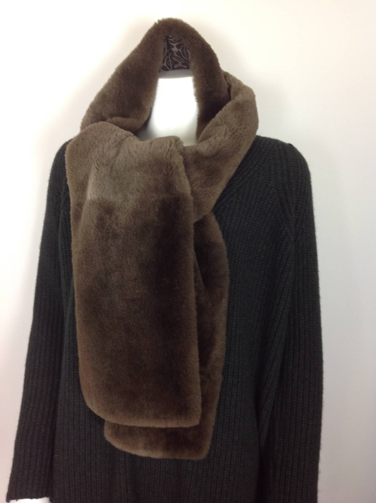 Soft and cuddly Sheared Nutria Hermes muffler.  Will  keep you warm all winter.
Backed in a silk and cashmere blend.  The print is a plummy brown and taupe, herringbone.  Hermes - Paris 2