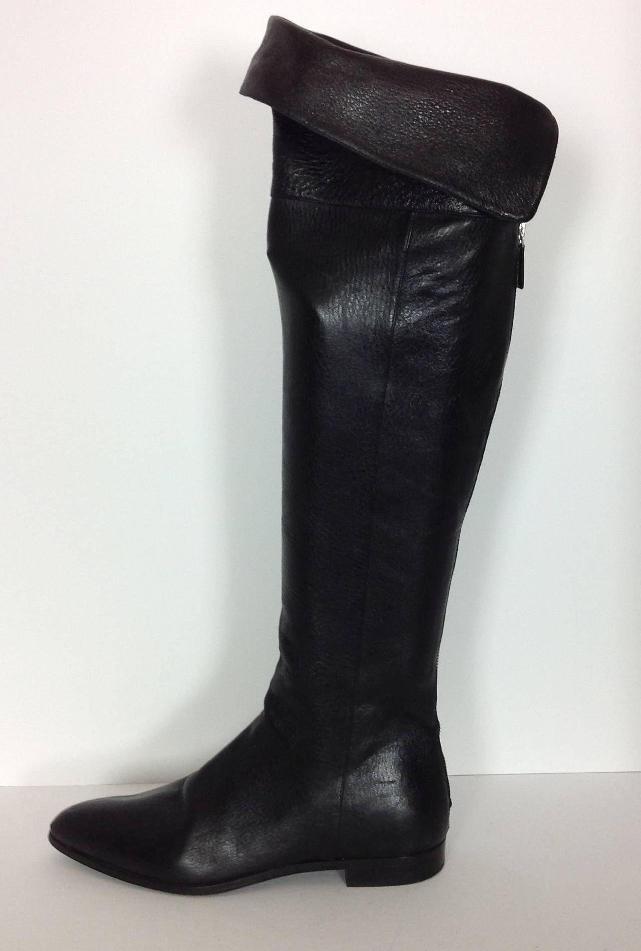 The softest black leather Prada over the knee boots.
Flat 3/4