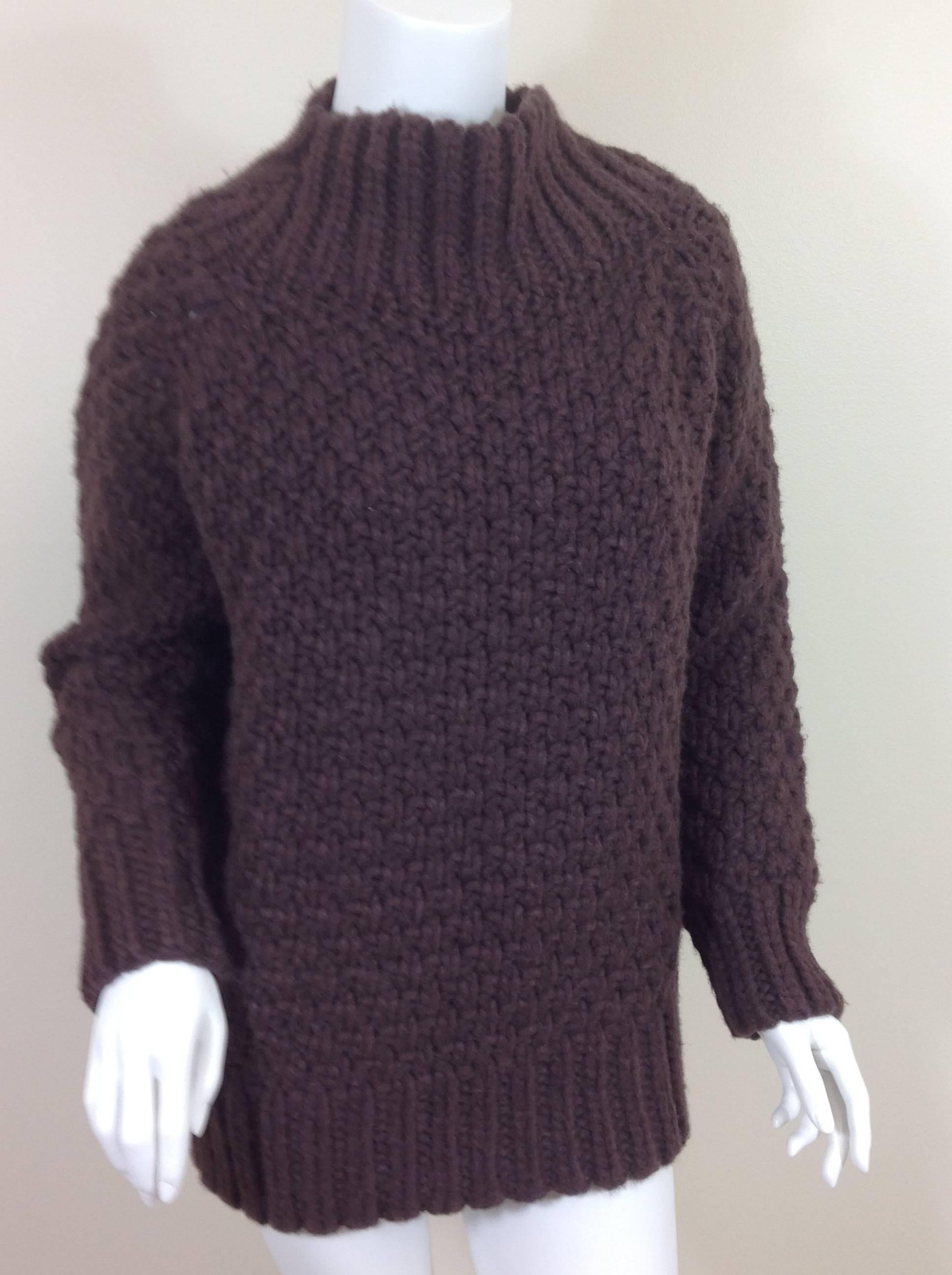 Hetty The Row funnel neck sweater.  Inticate basket weave stitch with raglan sleeves knit in. Ribbed neck, cuffs and hem.
100% lofty cashmere in aubergine . 
Made in the USA of imported yarn.
Fits true to size. All measurements taken while