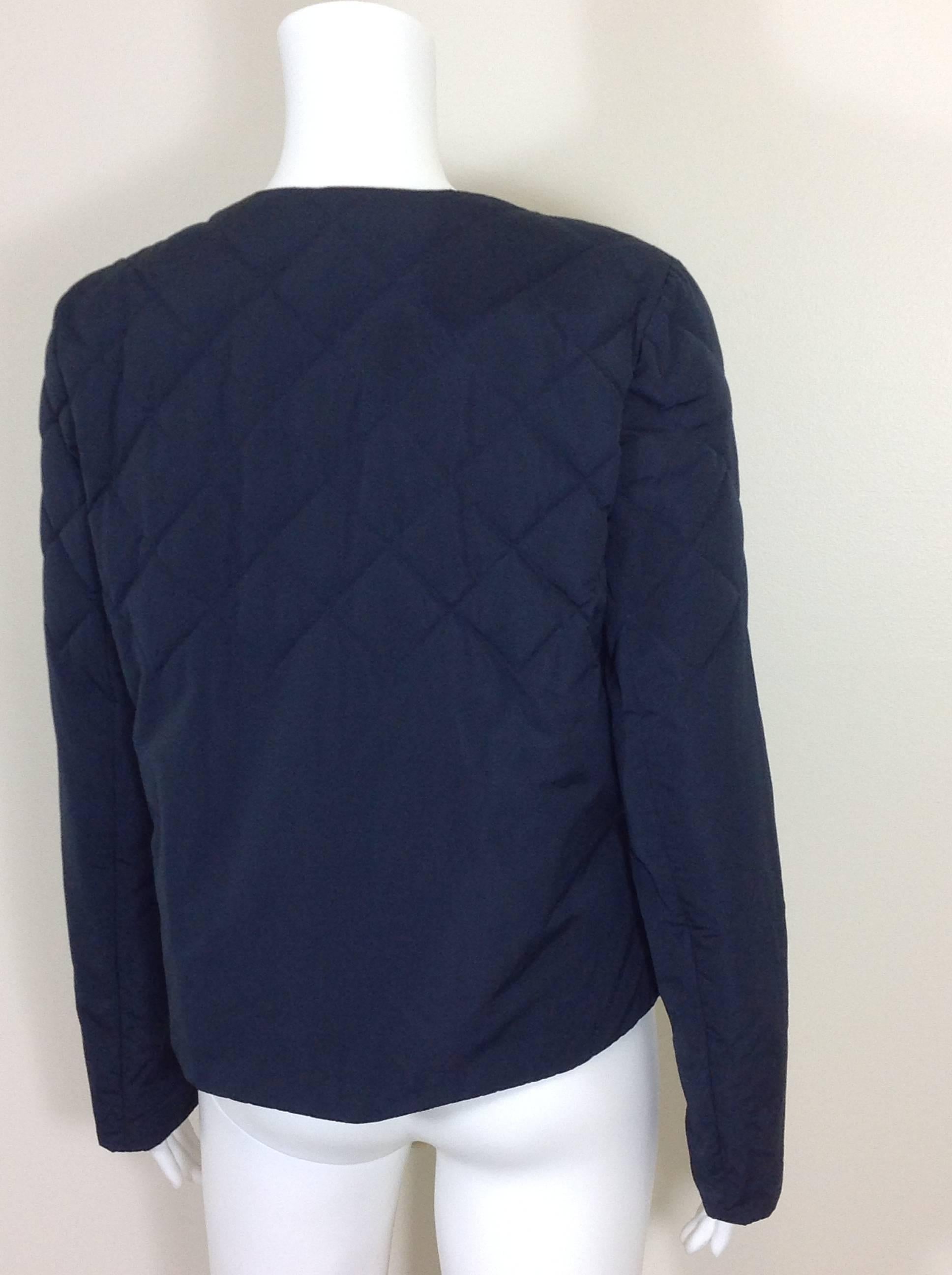 Sophisticated navy diamond quilted Brunello Cucinelli jacket.  Quilted on the top half of the jacket.  18.50