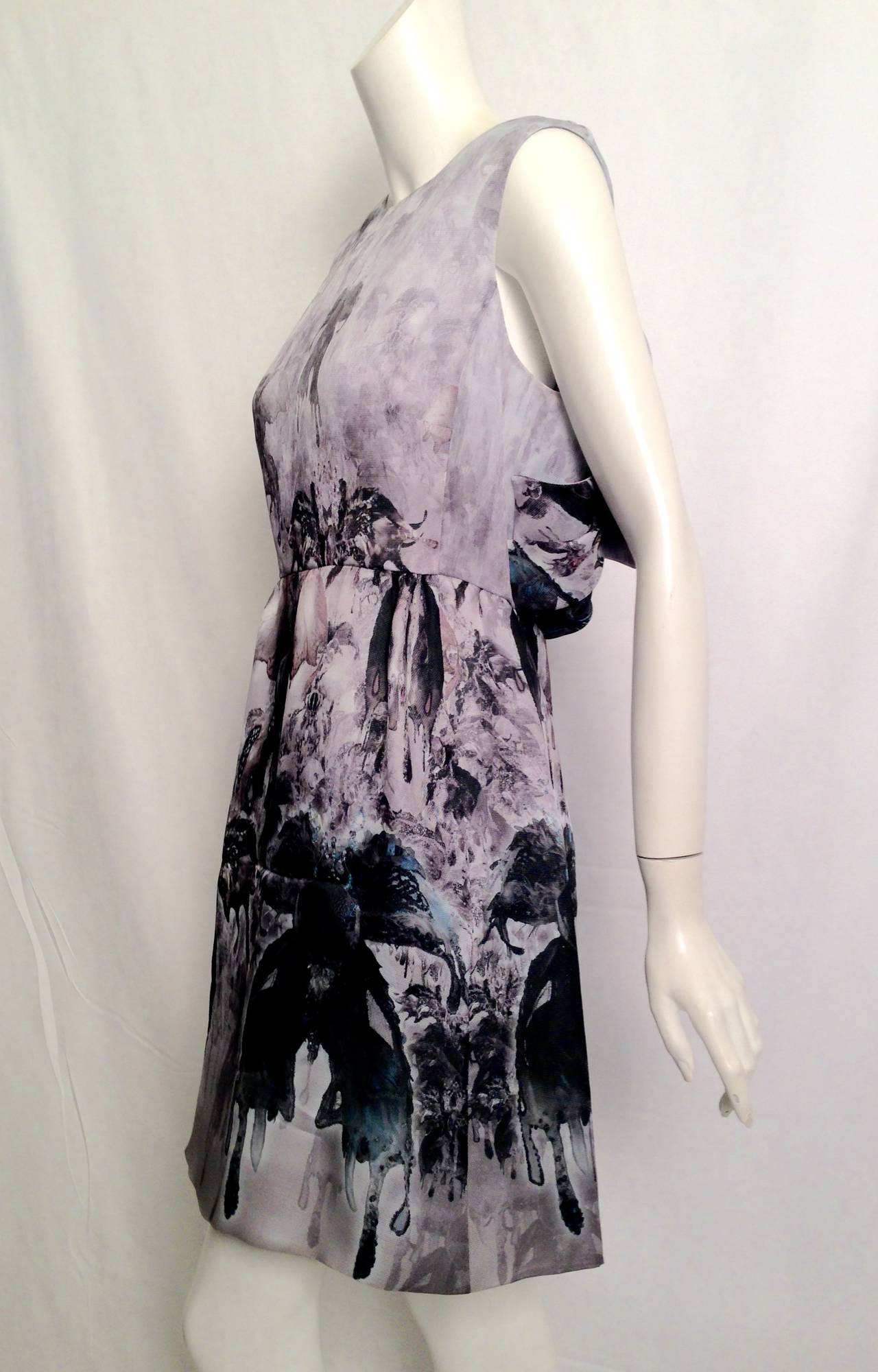 Leave them all in awe when arriving in this simply beautiful dress by the Italian Haute Couturier Valentino Garavani!  The abstract print belies the Old World techniques used to create this fantasy.  Dress is entirely lined in luxurious silk and has