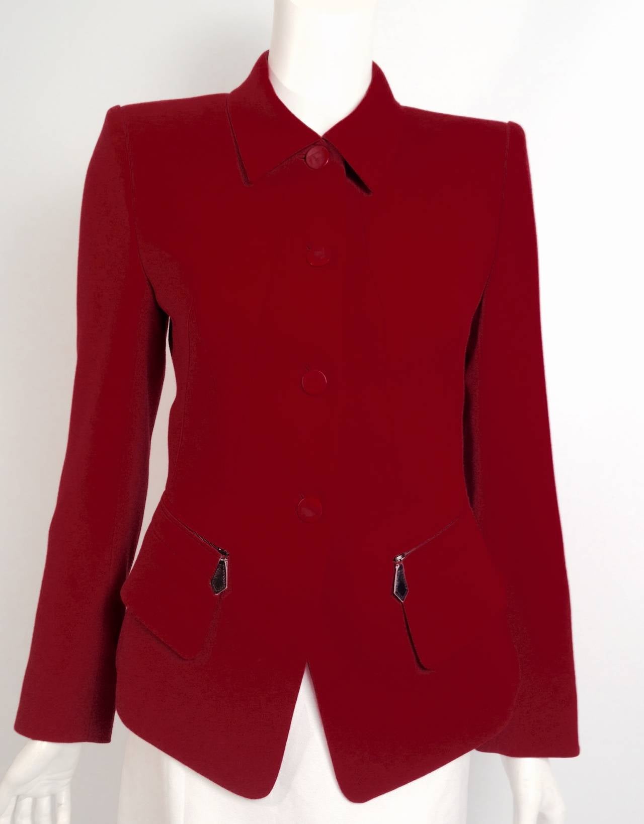 Handsome in Hermès!  Ravishing red fitted, cropped jacket is a testament to the heritage and tradition that is distinctly Hermès.  Features include luxurious claret wool fabric, two zippered pockets with leather pulls and two flap pockets. 