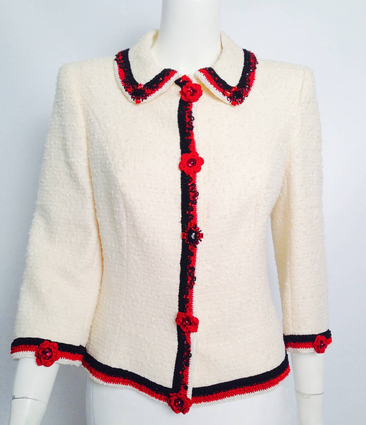 Take time to smell the roses in this Exquisite Escada Embroidered Tweed Jacket!  Brand new with manufacturer and Saks Fifth Avenue tags, jacket is crafted from an elevated wool blend that yields the characteristic  