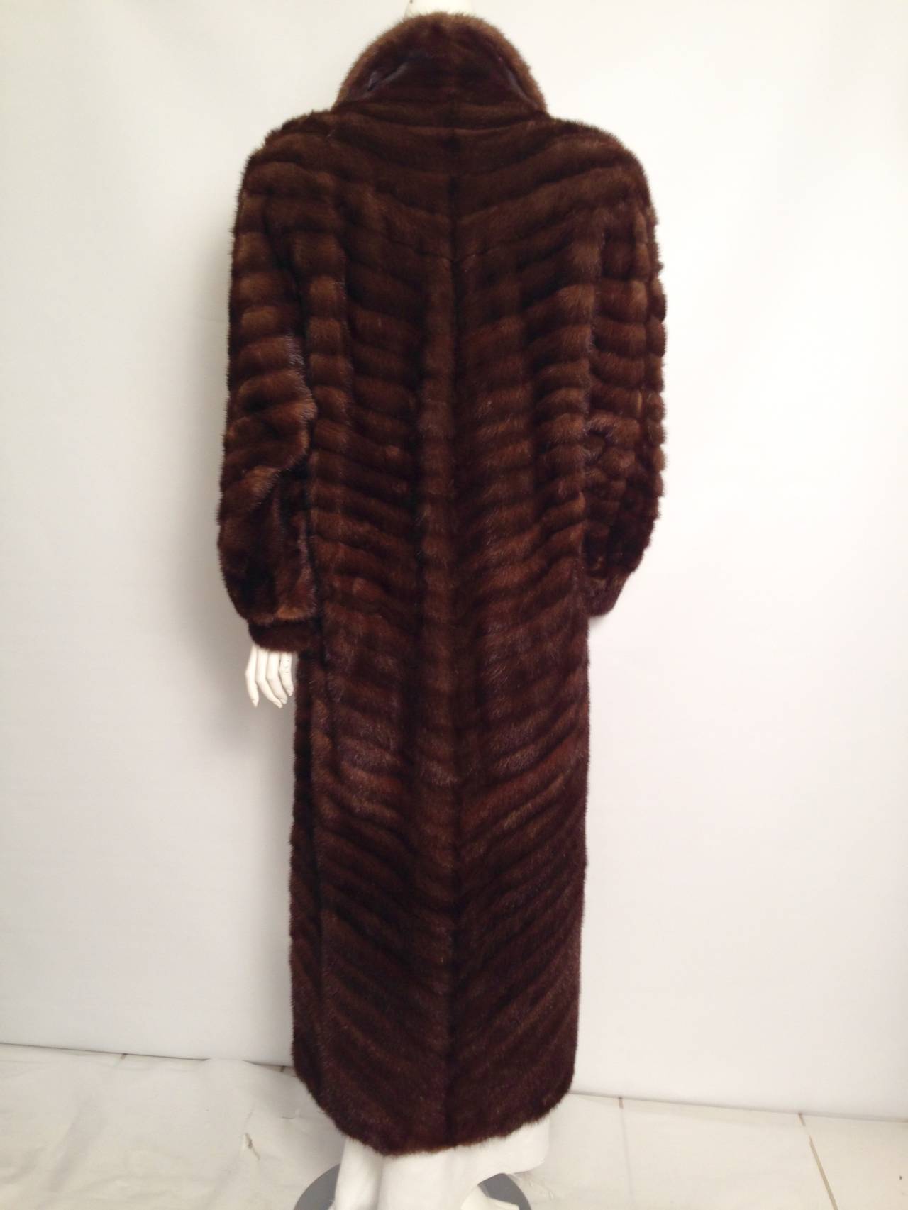 Natural Brown Mink worthy of the Revillon label fit for a starlet!  Absolutely stunning example of exalted craftsmanship.  Diagonal pelts swirl about the body to create a fantasy of fur.  Features include dolman silhouette and slightly poufed 