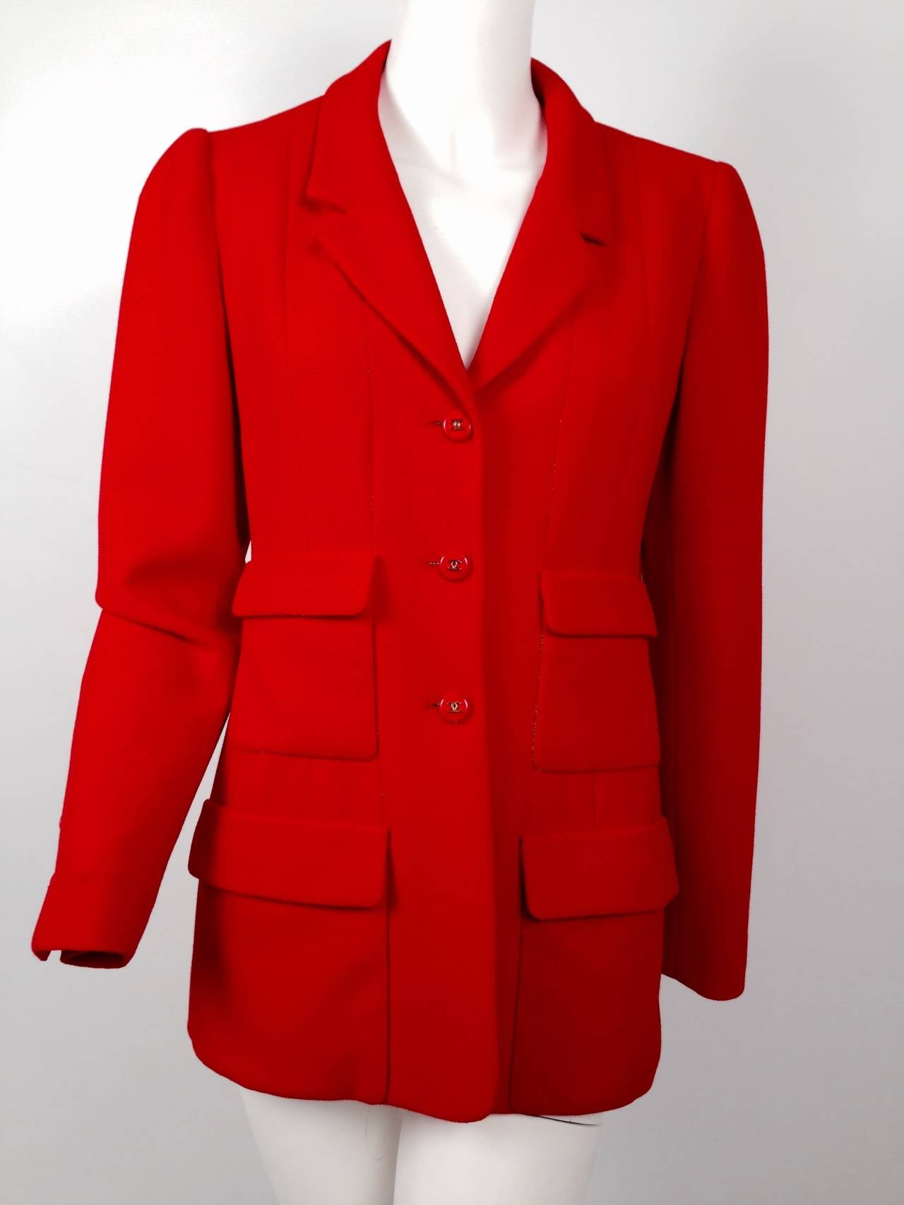 Chanel's red pique jacket is sporty AND elegant!  Decidedly Coco, jacket celebrates a relaxed but tailored silhouette.  Features notched lapel, four front patch pockets with flaps, double 