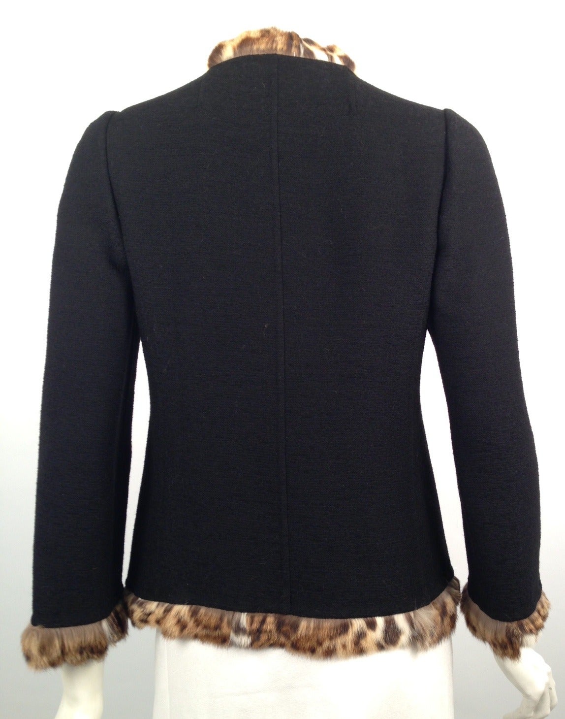 Oscar de la Renta Wool Jacket With Lippi fur trim is an excellent example of this world-renowned designer's passion for fashion!  What would make a simple jacket fabulous?  Fur trim!  Not just any fur...but lippi!   Unlined jacket will quickly