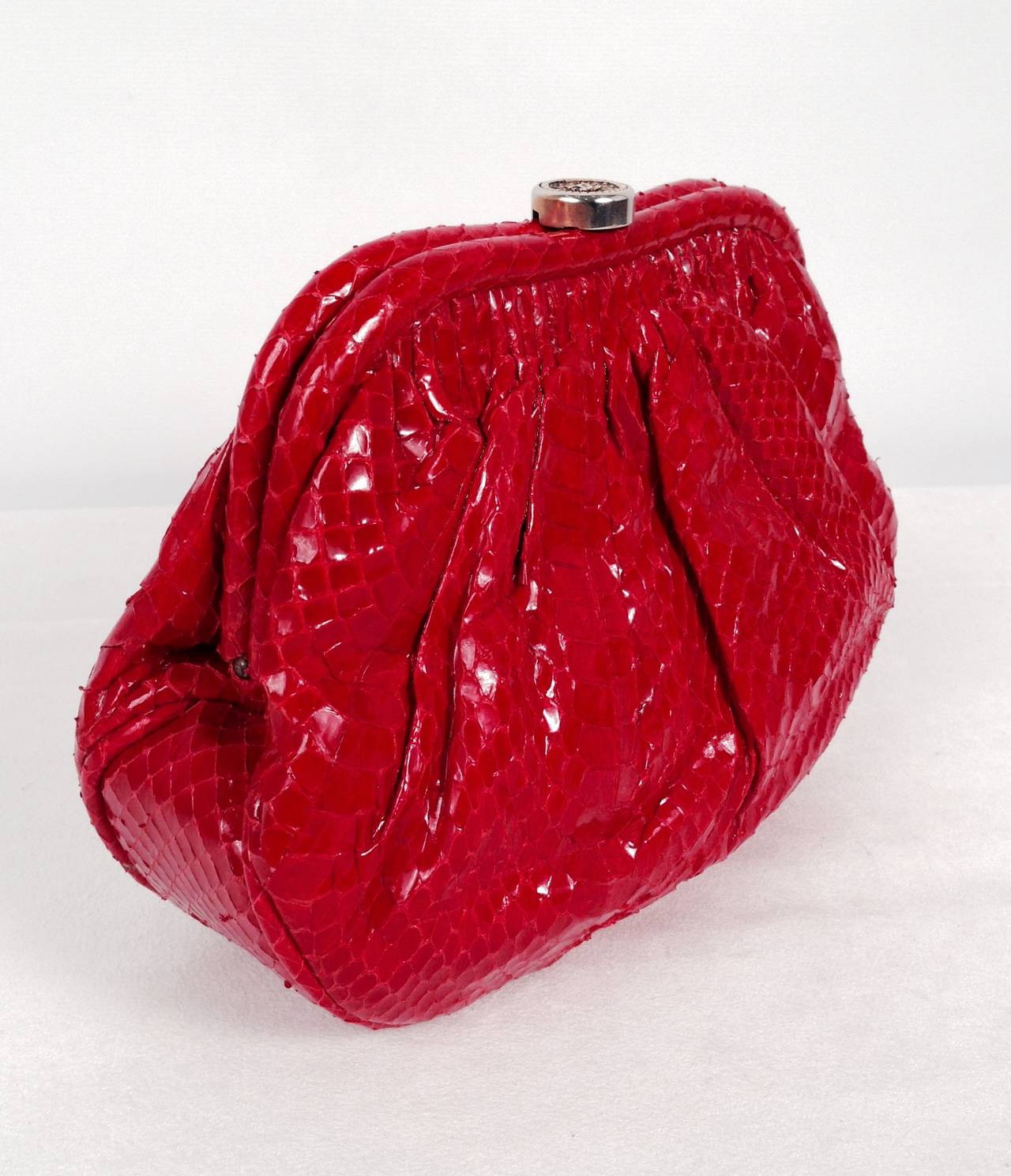 Chanel Lipstick Red looks best in python!  This bag's condition truly belies its vintage status.  Features the best butter-soft python that only gets better with age!  Fully lined in 100% leather.  Satin lined interior flat pocket has zipper. 