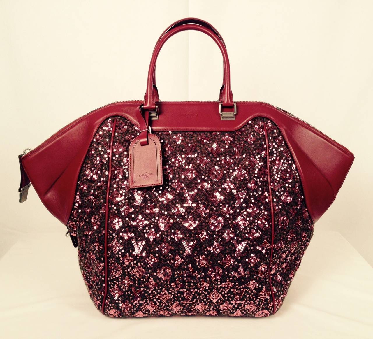 Louis Vuitton Sequin Monogram Sunshine Express North South in Burgundy graced the Fall 2012 runway in Paris! Never used, this wool tote is entirely covered in sequins that actually create the world famous Louis Vuitton monogram. The bag features