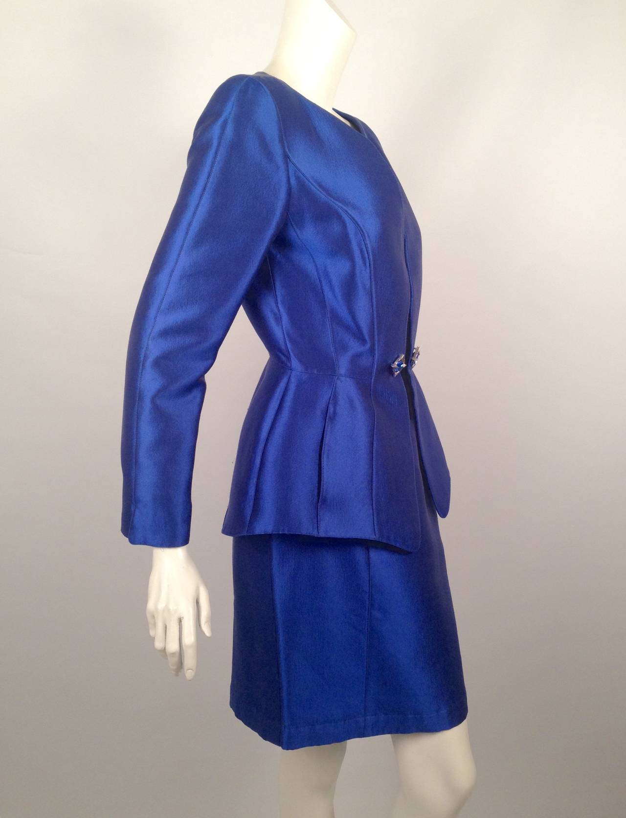 Relieve the Late 80's and Early 90's in this vintage Thierry Mugler skirt suit.  Suit features signature Mugler hour-glass silhouette and a most luxurious wool and silk blend.  Decidedly feminine jacket has two cleverly hidden pockets, velvet panel