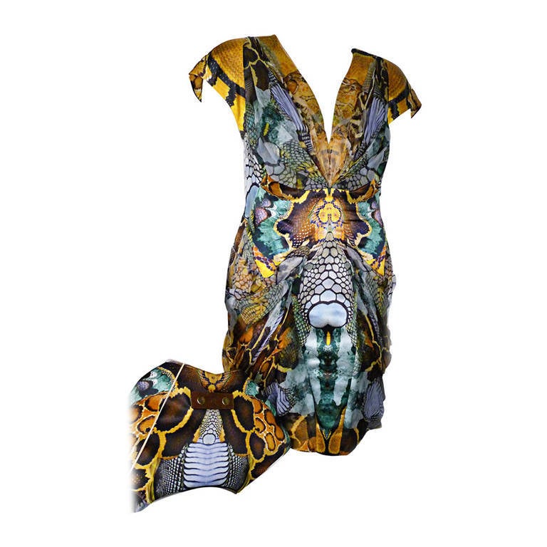 Own a piece of fashion history! From Alexander McQueen’s Spring/Summer 2010 “Plato’s Atlantis” collection, this python print dress is a standout. Form-fitting with sheer silk insets over the same pattern of silk satin, this wild, figure-flattering