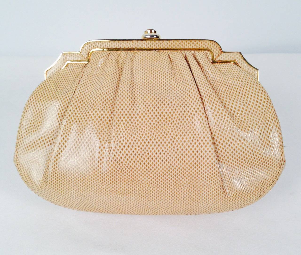 Vintage Taupe Lizard Evening Bag is highly desired by all collectors of Judith Leiber! Features slightly gathered, butter-soft lizard skin. Bag easily converts from clutch to shoulder bag with minimal effort!  Advanced design accommodates more items