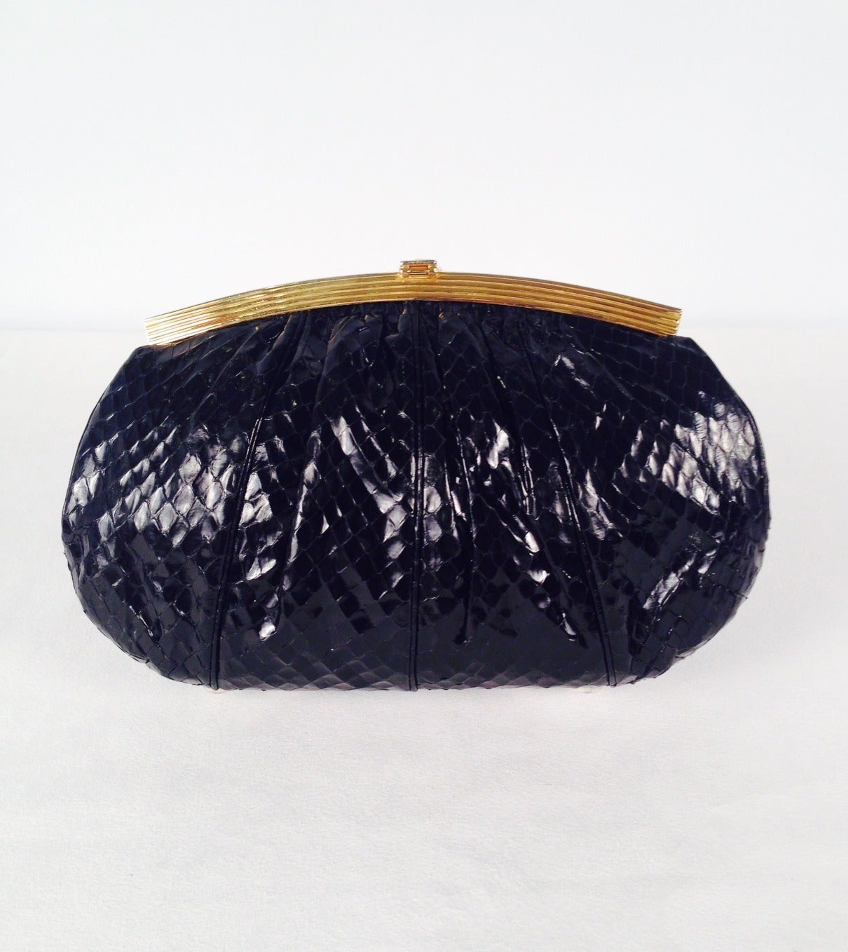 Vintage Black Snakeskin Evening Bag is highly desired by all collectors of Judith Leiber! Features butter-soft snakeskin and easily converts from clutch to shoulder bag with minimal effort!  Gathered design accommodates more items as necessary.