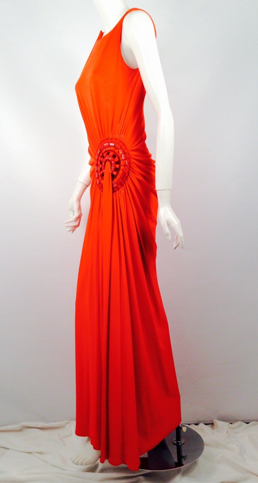 Carolina Herrera Mandarin Orange Draped Evening Dress will leave them all in awe!  Precious silk literally celebrates the natural curves of a woman's body.  Sleeveless dress features exquisite embroidery, elevated beadwork and grosgrain ribbon