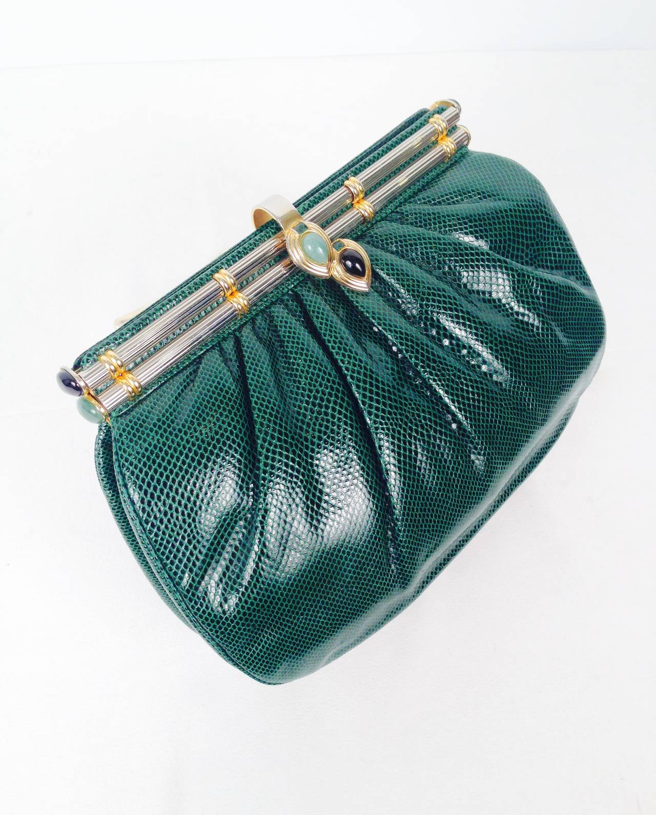 Vintage Emerald Lizard Evening Bag is highly desired by all collectors of Judith Leiber! Features slightly gathered, butter-soft lizard skin. Bag easily converts from clutch to shoulder bag using lizard strap with minimal effort! Forgiving gusset