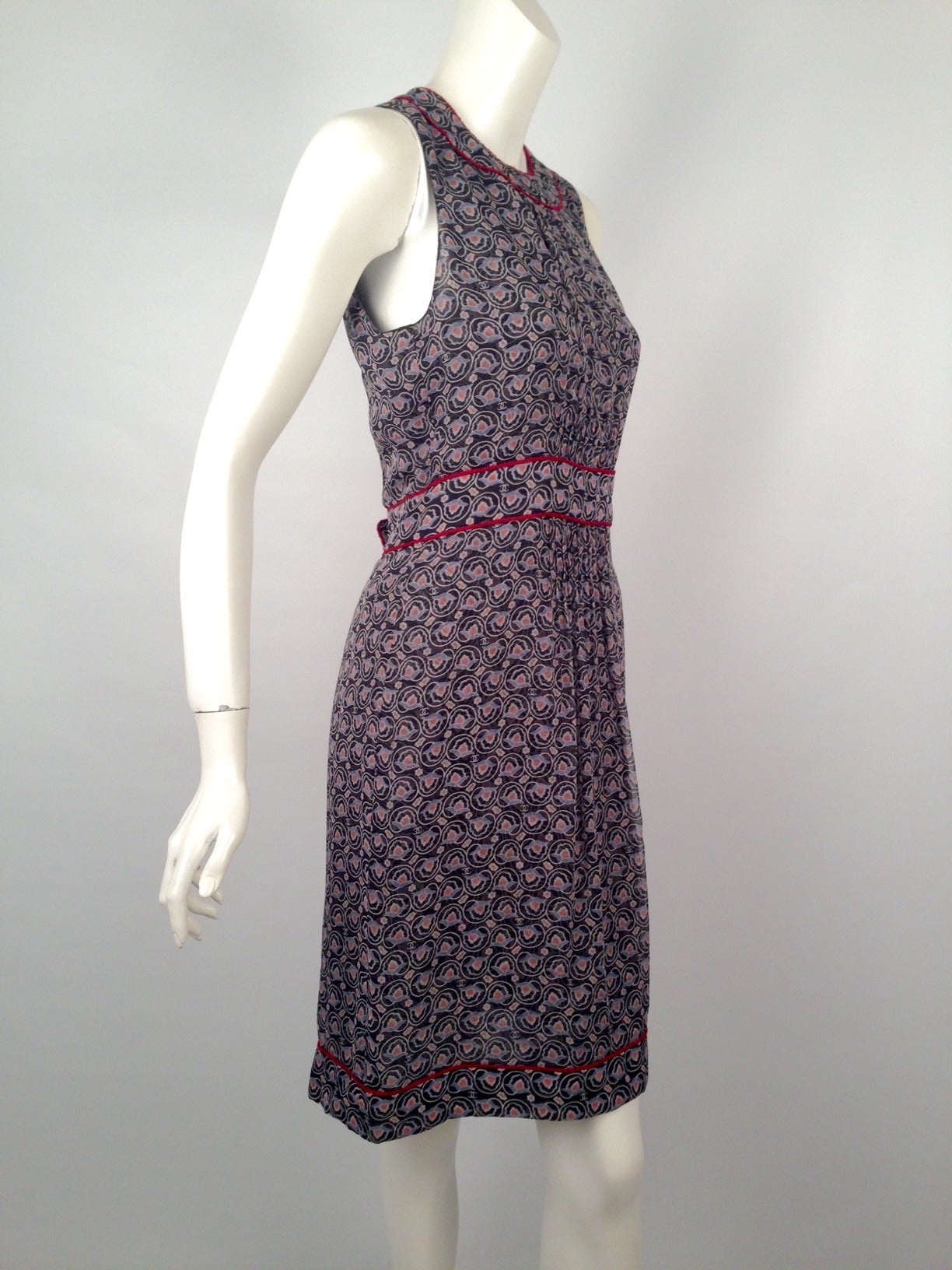 Spring 2004 Chanel Navy Silk Floral Print Sleeveless Dress is an excellent example of what made Coco 