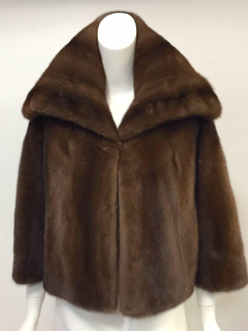 This Brown Mink Coat proves that Mary McFadden is much more than extensive beading and her trademarked pleated fabric!  Features beautiful brown pelts deserving of the 