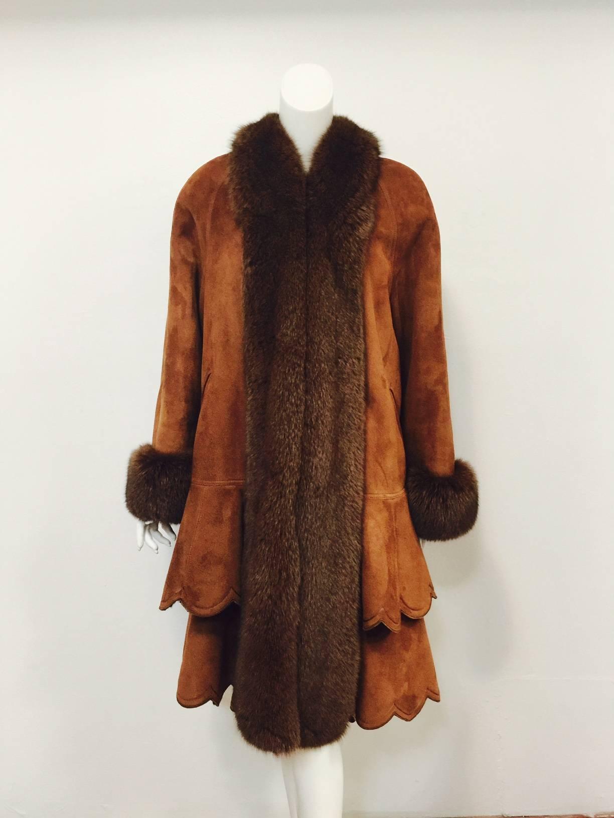Christia Cognac Shearling Coat With Fox Trim takes full advantage of superior materials and exalted craftsmanship!  Featuring uber-feminine swing silhouette, this stunning shearling is perfectly complemented by beautiful brown fox tuxedo collar and