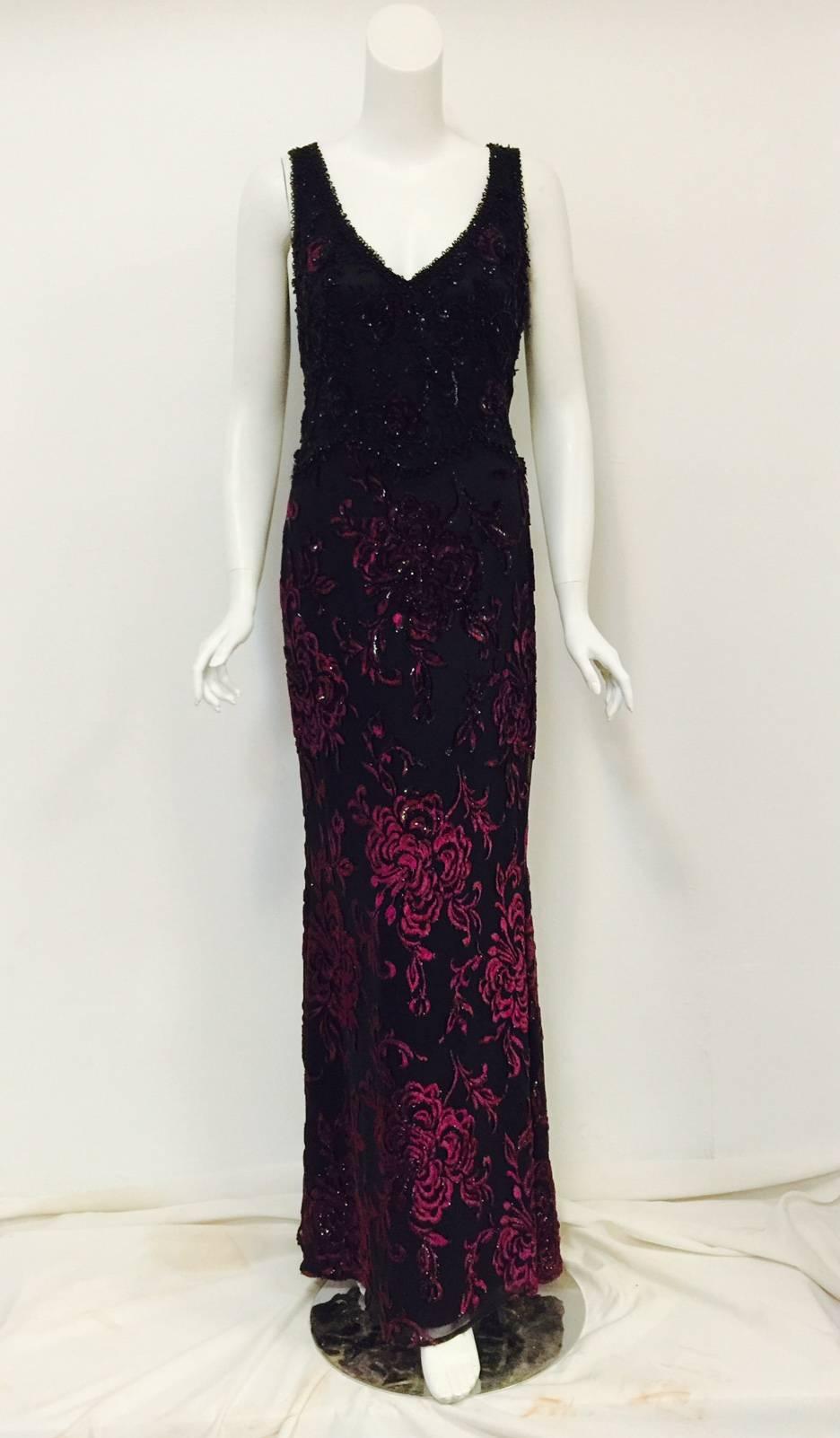 Escada Couture Embroidered Silk Evening Dress is worthy of any Red Carpet and indeed ready for a closeup!   Features a bias-cut sleeveless sheath silhouette cut from luxurious black silk.   Exquisite burgundy velvet floral appliques are enhanced