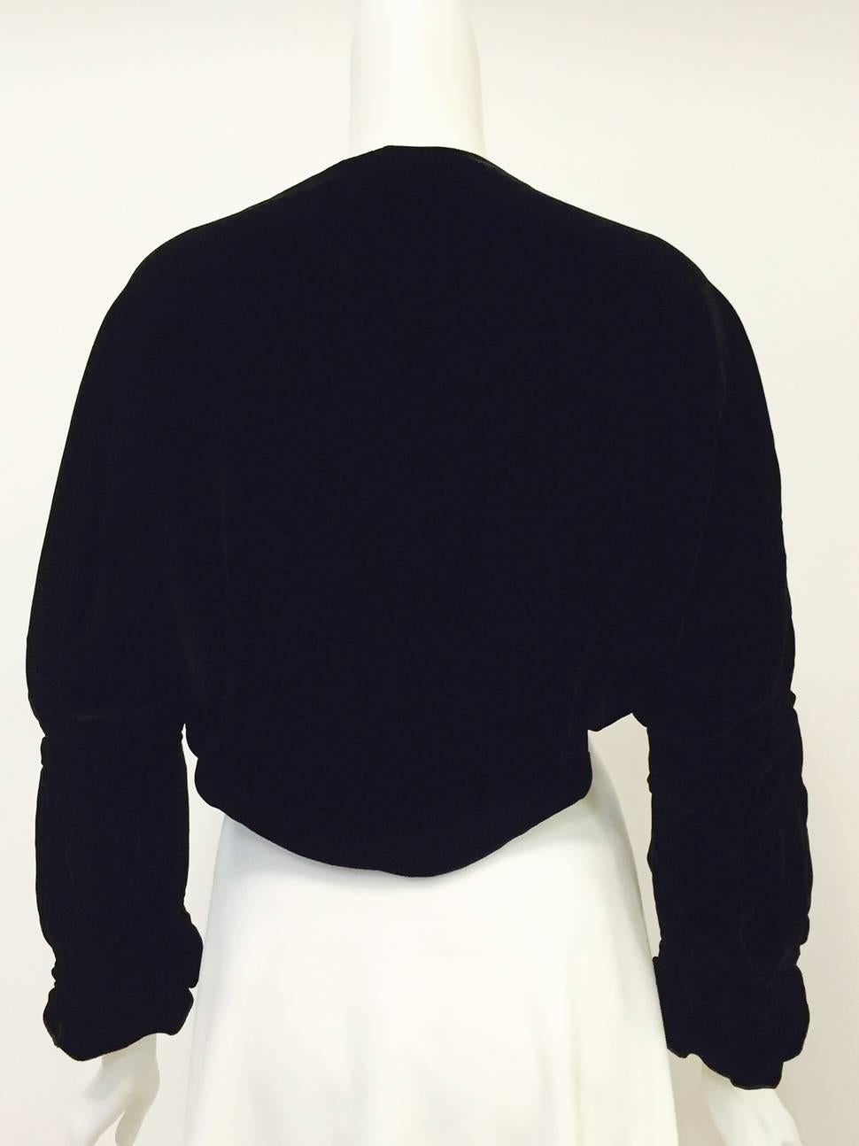 New Giorgio Armani Black Velvet Shrug is the perfect choice when an evening calls for a most elegant cover-up!  Features luxurious fabric inside and out...Velvet exterior is advanced gathering techniques worthy of a Shakespearean tragedy! 