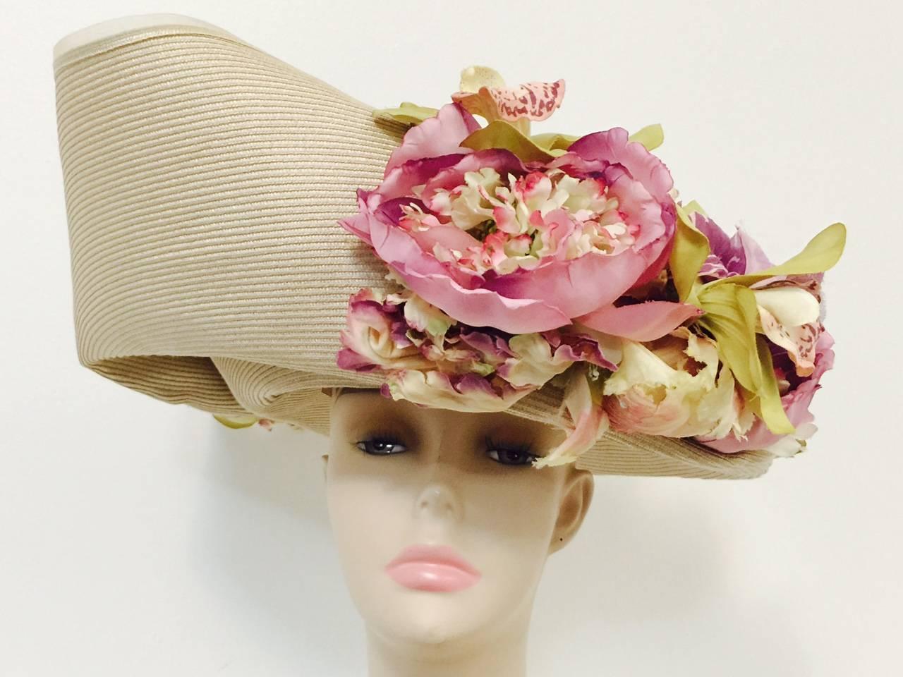 Eric Javits Custom Hat Worn at The Ascot Races was designed with the Ascot in mind!  Worthy of a British Royal, hat features upturned wide brim with custom folds and luscious lillys in full bloom!  Signed by the star milliner himself!  Is it