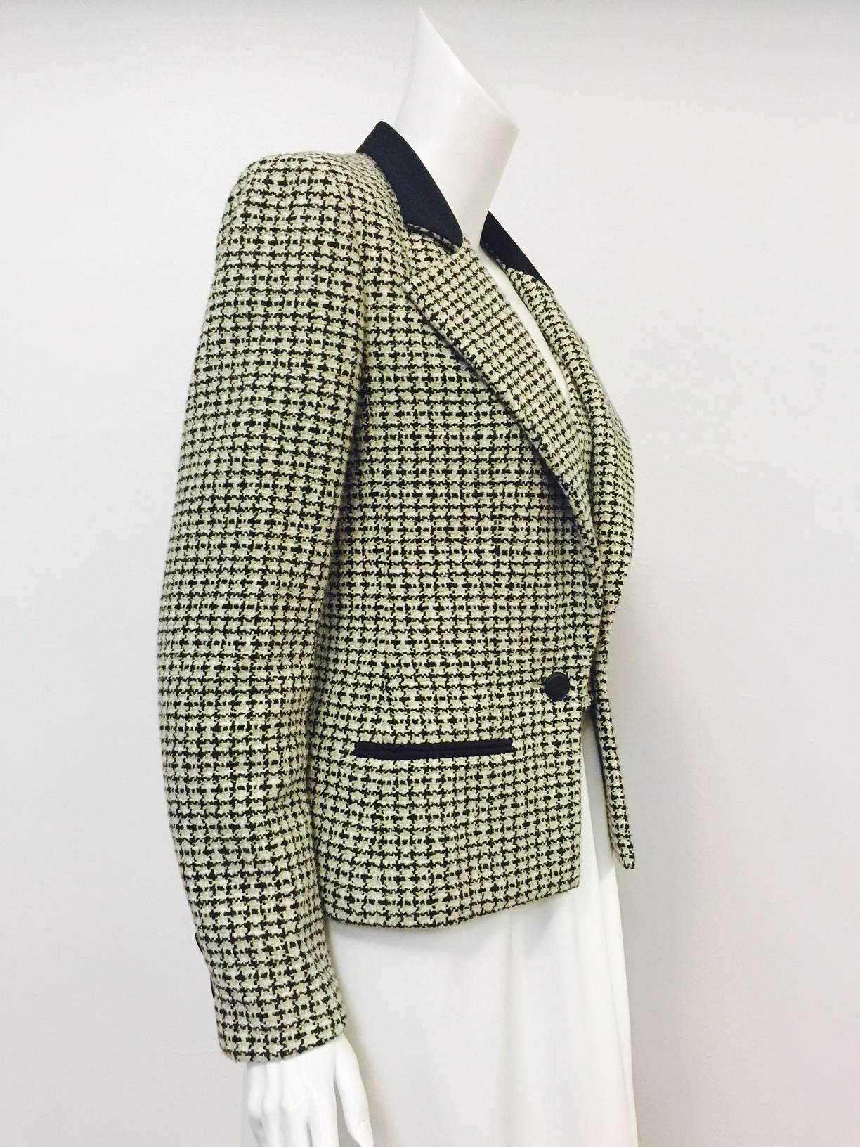 Chanel Spring 2002 Houndstooth Jacket is yet another brilliant example of the ageless, timeless designs that define the house that Coco built!  Primarily Spanish olive, black and ivory, jacket features luxurious signature cotton tweed fabric