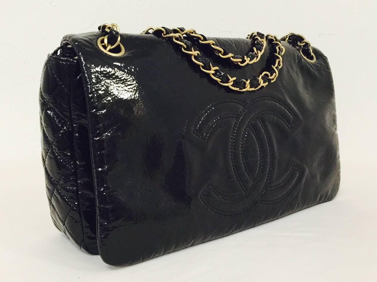 Black Patent Leather Flap Bag is a must for all devotees of the Great Coco Chanel!  Crafted from ultra-soft black patent leather, shoulder bag features the world renowned double 