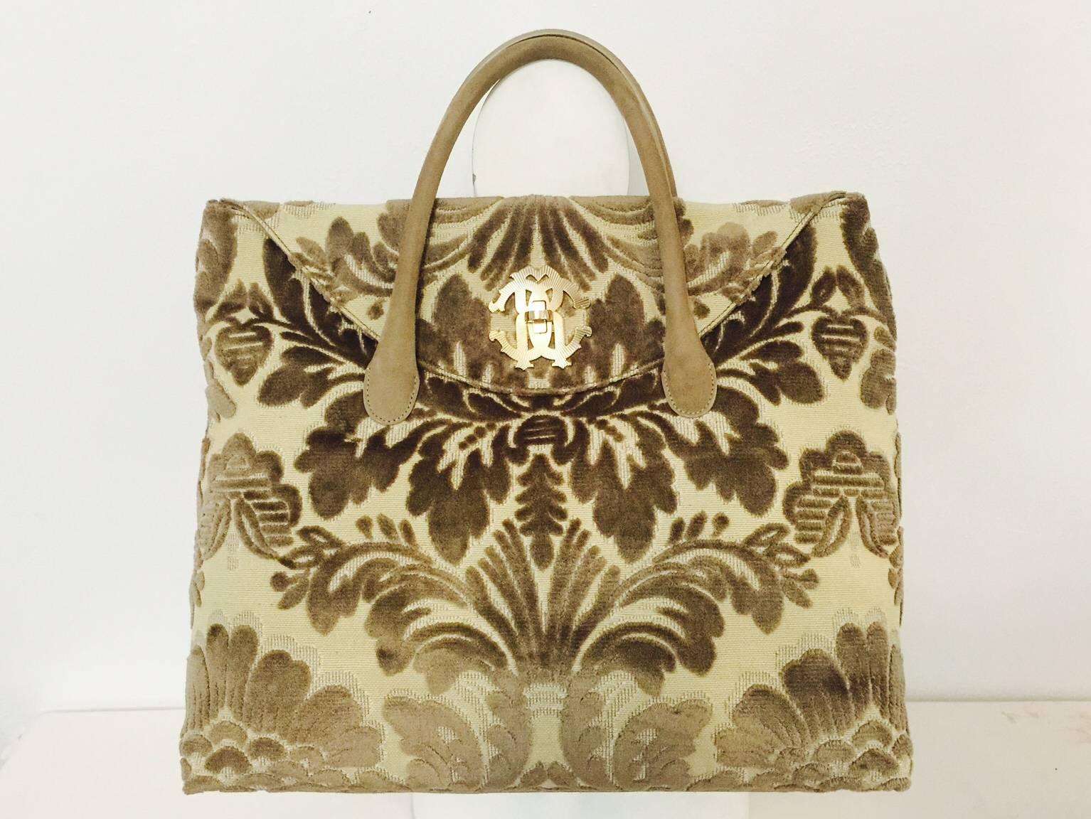 New Roberto Cavalli Moss Velvet Carpet Bag is reminiscent of priceless tapestries and 19th Century totes carried by industrialists heading South during Reconstruction.  Features Moss green floral 