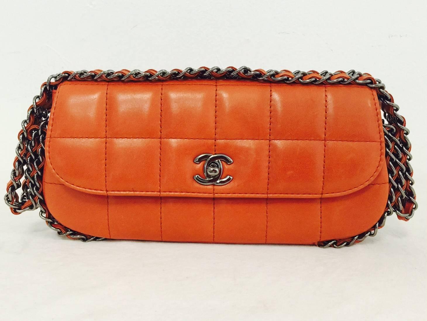  Box Quilted Lambskin Flap Bag proves that Chanel is so much more than diamond quilted flap bags!  Features supple box quilted lambskin in an alluring shade of Terra Cotta and dark silver hardware.  Interior is lined in luxurious tan fabric printed