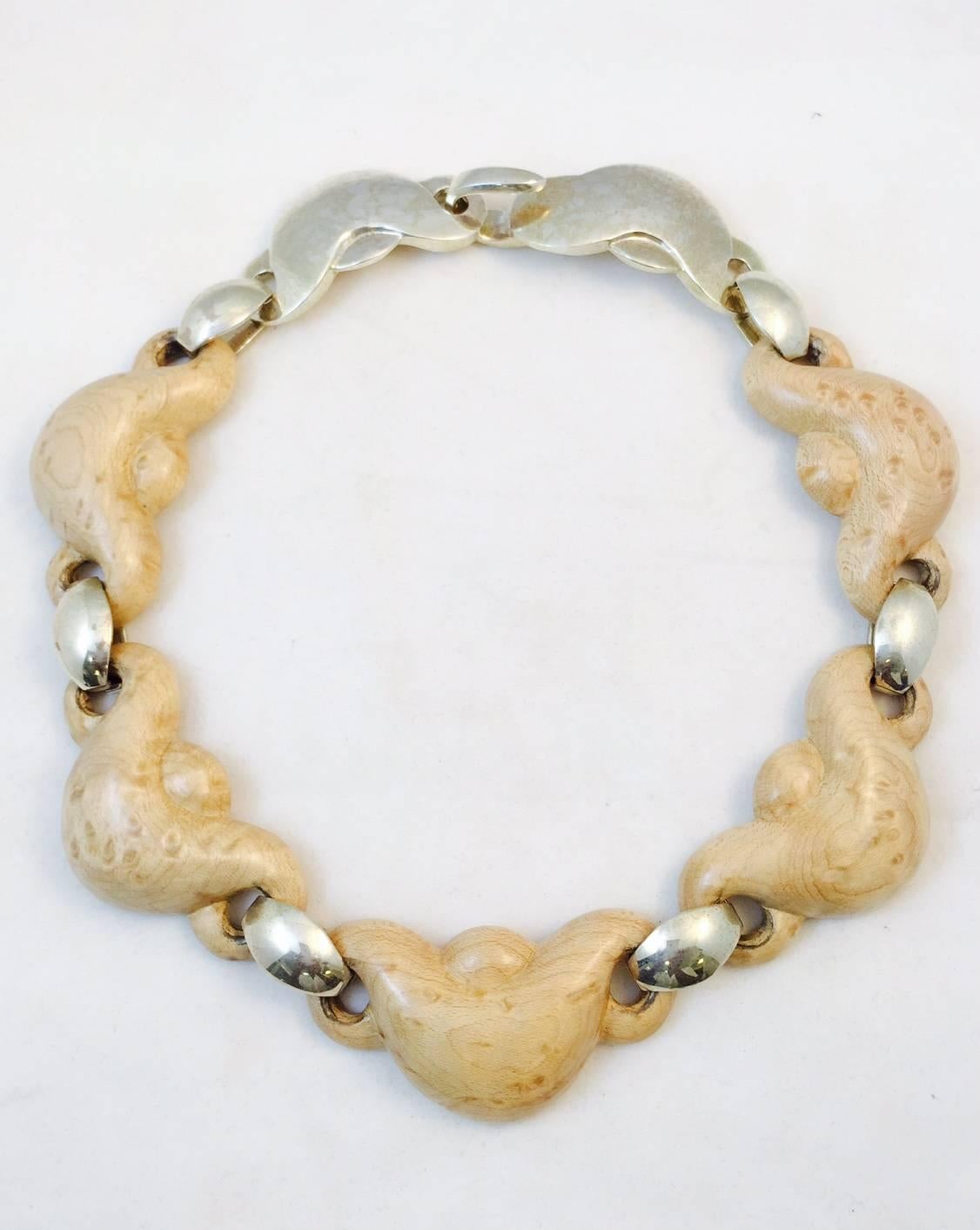 Patricia Von Musulin creates unique, one-of-a kind pieces.  Her artistry is unsurpassed.  Curvy, feminine stations of birds eye maple are so organic and sensual!  Matching the curves are connectors in sterling silver with a sterling silver clasp