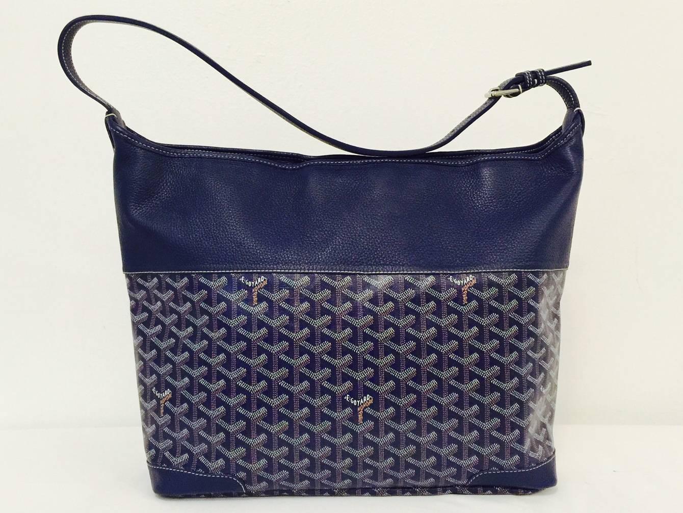 New Goyard Blue Grenadines Tote is a must for those who desire something special from this legendary leather goods maker!  This hobo tote features iconic chevron patterned canvas, silver-tone hardware, adjustable shoulder strap and beautiful blue