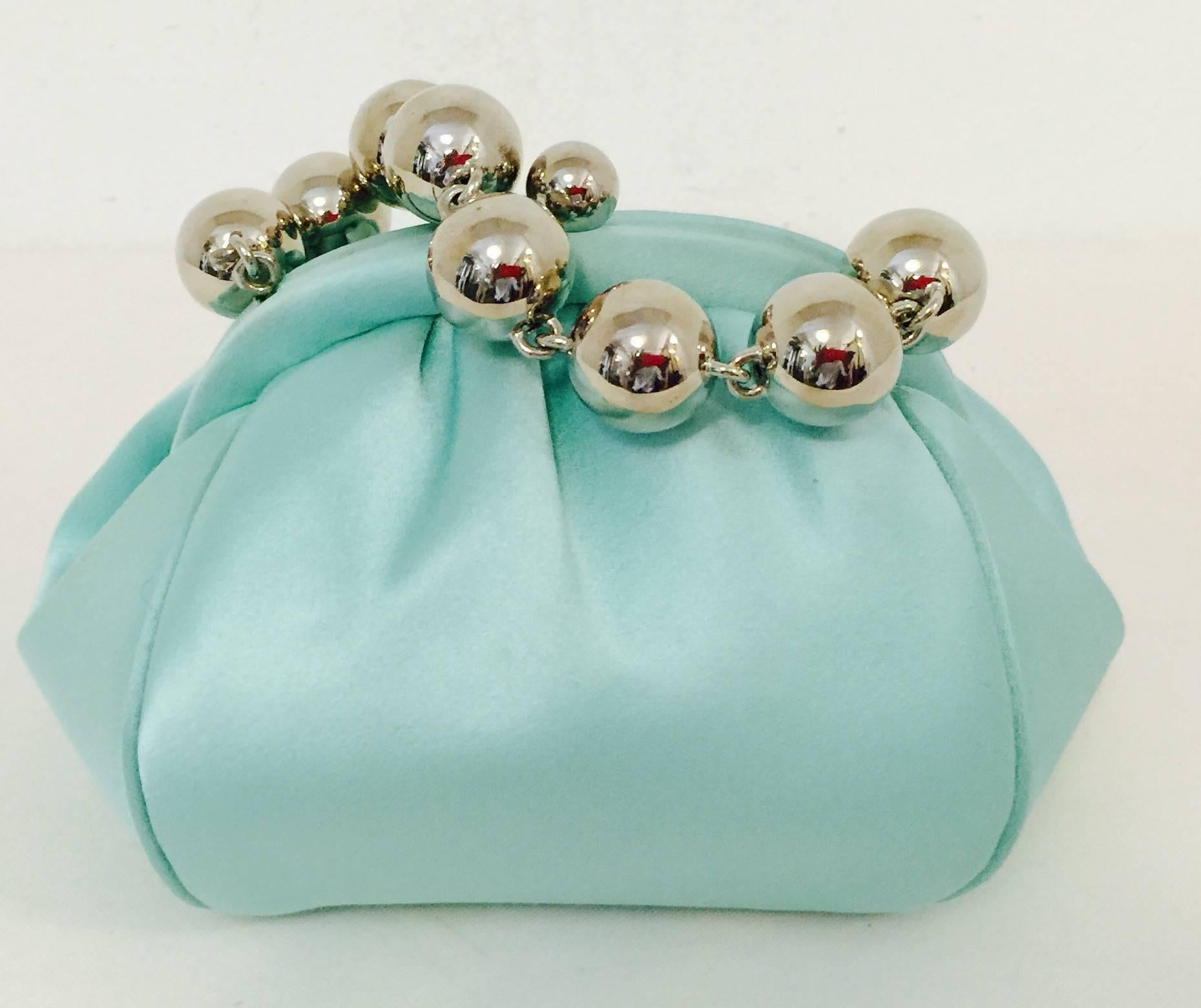 Tiffany & Co. do much more than create some of the world's most desirable gems!  Since being introduced, this Tiffany & Co. Bracelet Bag has become a highly coveted evening frame bag.  Features easily recognizable 