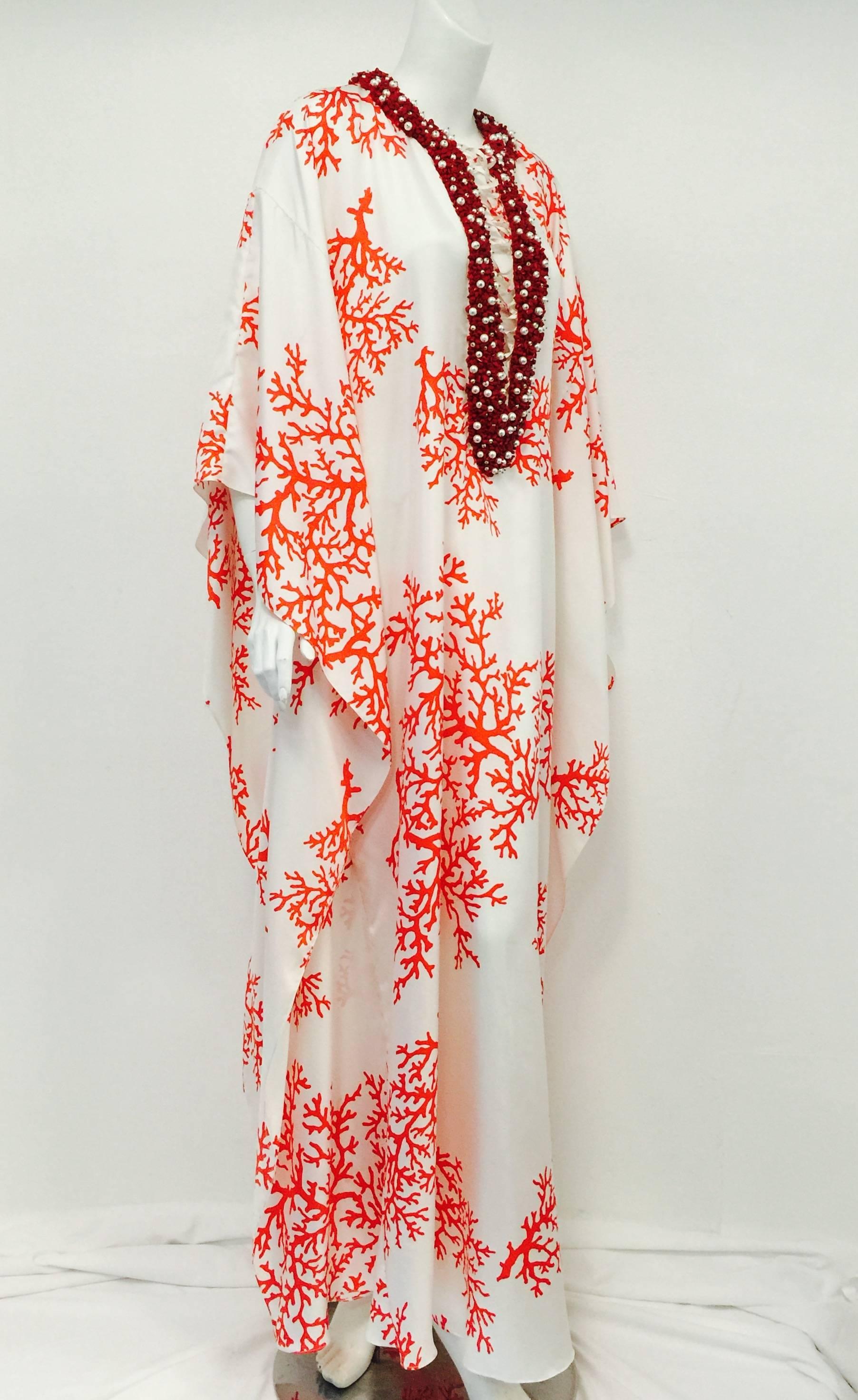 Ultra Luxurious Silk Caftan With Coral Encrusted Neckline shows why Andrew GN has been celebrated for his ultra-luxurious designs worldwide.  For Andrew, only the best will do!  Born in Singapore, this designer's has clearly been influenced by Asian