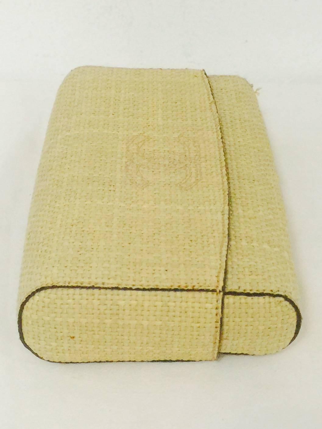 Tan Clutch With Burgundy Leather and Fabric Interior proves that Chanel is so much more than diamond quilted leather bags!  Crafted in the late 1990's, bag is in Above Excellent Condition.  Features natural raffia exterior with double 