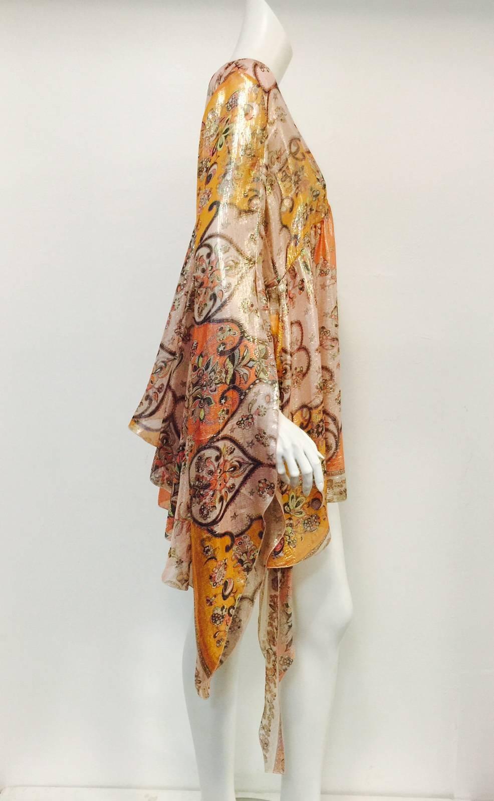 Take flight in this Pucci Silk Blend Lame Tunic Dress!  Dress features signature 