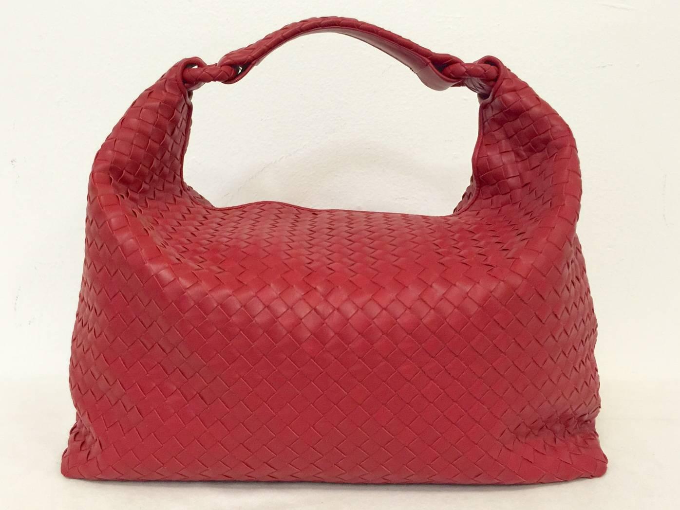 Bottega Veneta Red Hobo is a primary example of why this Italian house has such a loyal following worldwide!  Features signature 