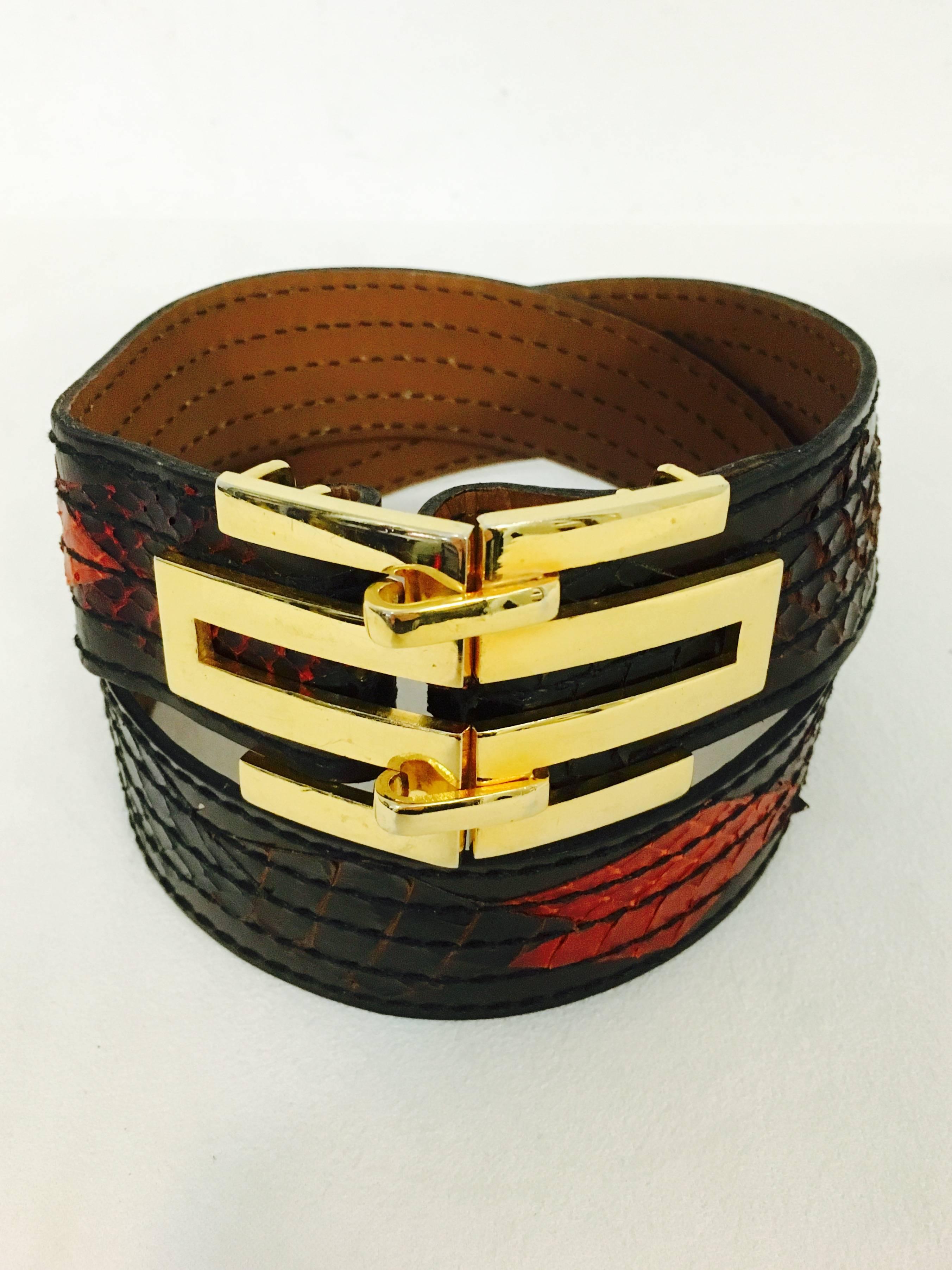 Vintage Gold Tone Christian Dior Leather Belt is a must for any connoisseur of this legendary couturier!  Chocolate leather is made fabulous with multiple geometric python skins in a variety of colors including Bordeaux, Black, Forest, Orange.  Tan