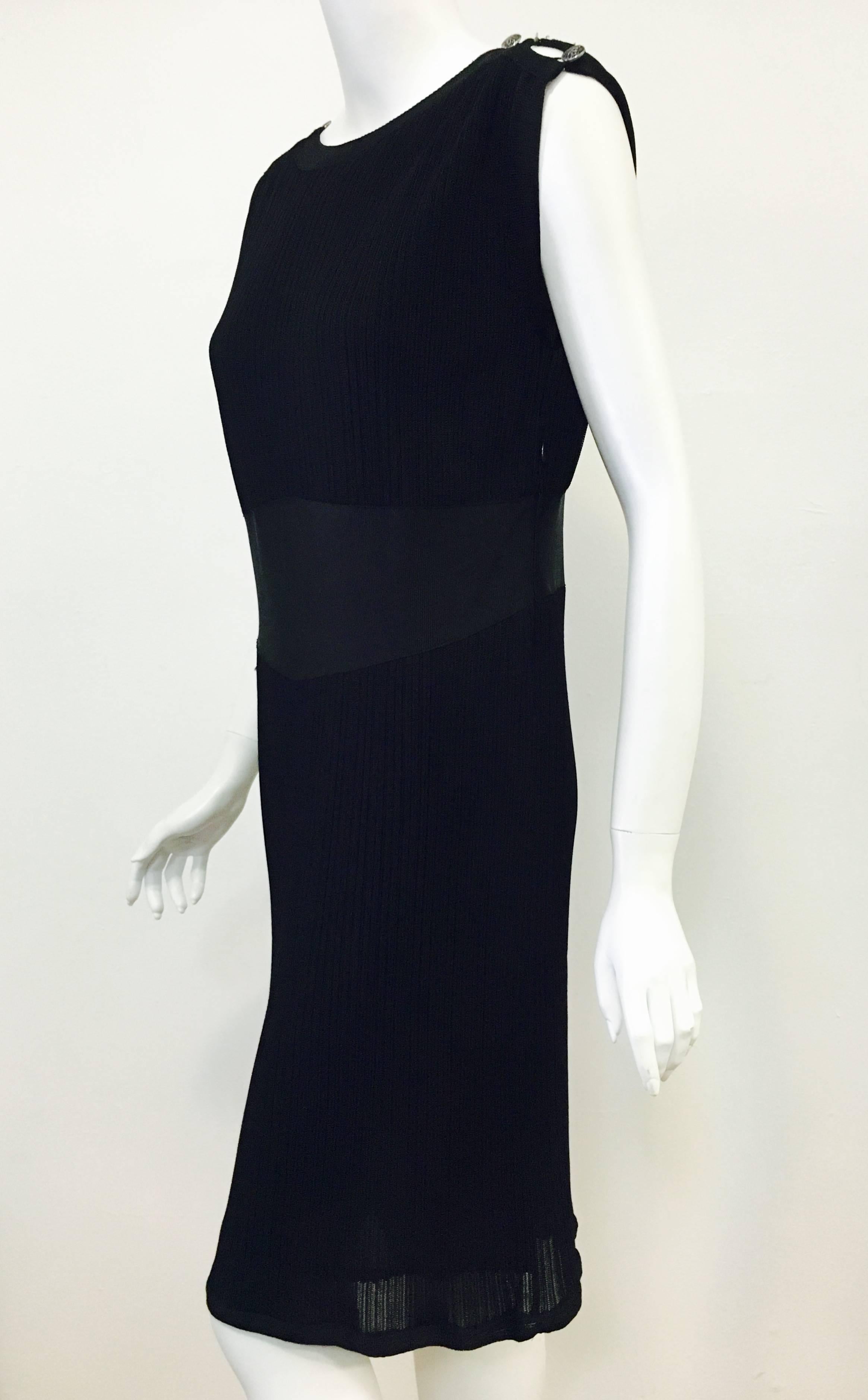 There's always room in your closet for one more LBD, especially when it's Chanel!  This classic features ribbed knit edged and accented by ribbed trim.  Scoop neck in front with a bit lower scoop back accented by CC logo.  Bust area lined in cotton