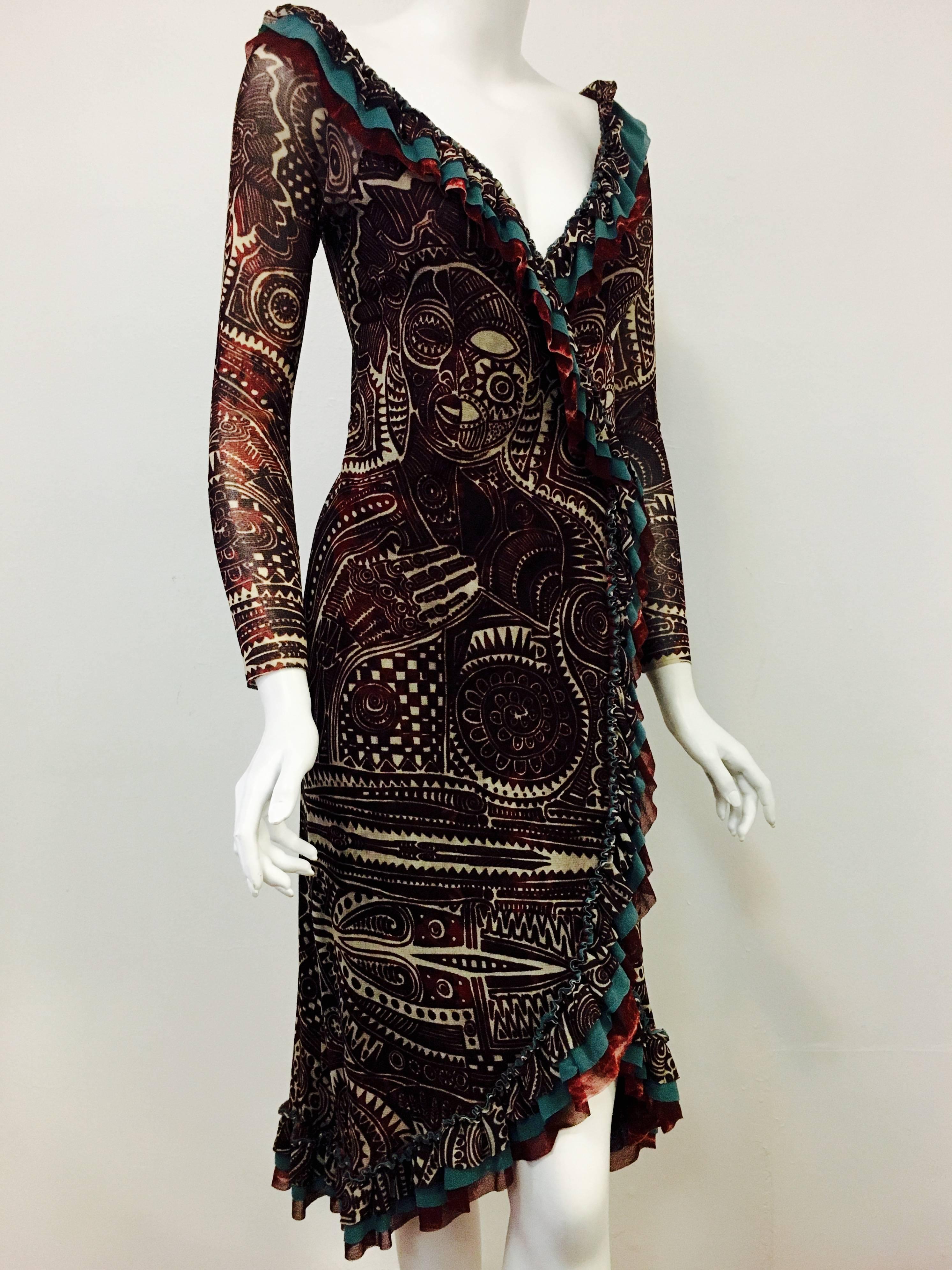 This is the dress you need for so many events!  From the esteemed house of Jean Paul Gaultier comes his take on the classic wrap dress.  Body is totally lined, sleeves depict the sheer fabric beautifully.  Asymmetrical hemline measures 42