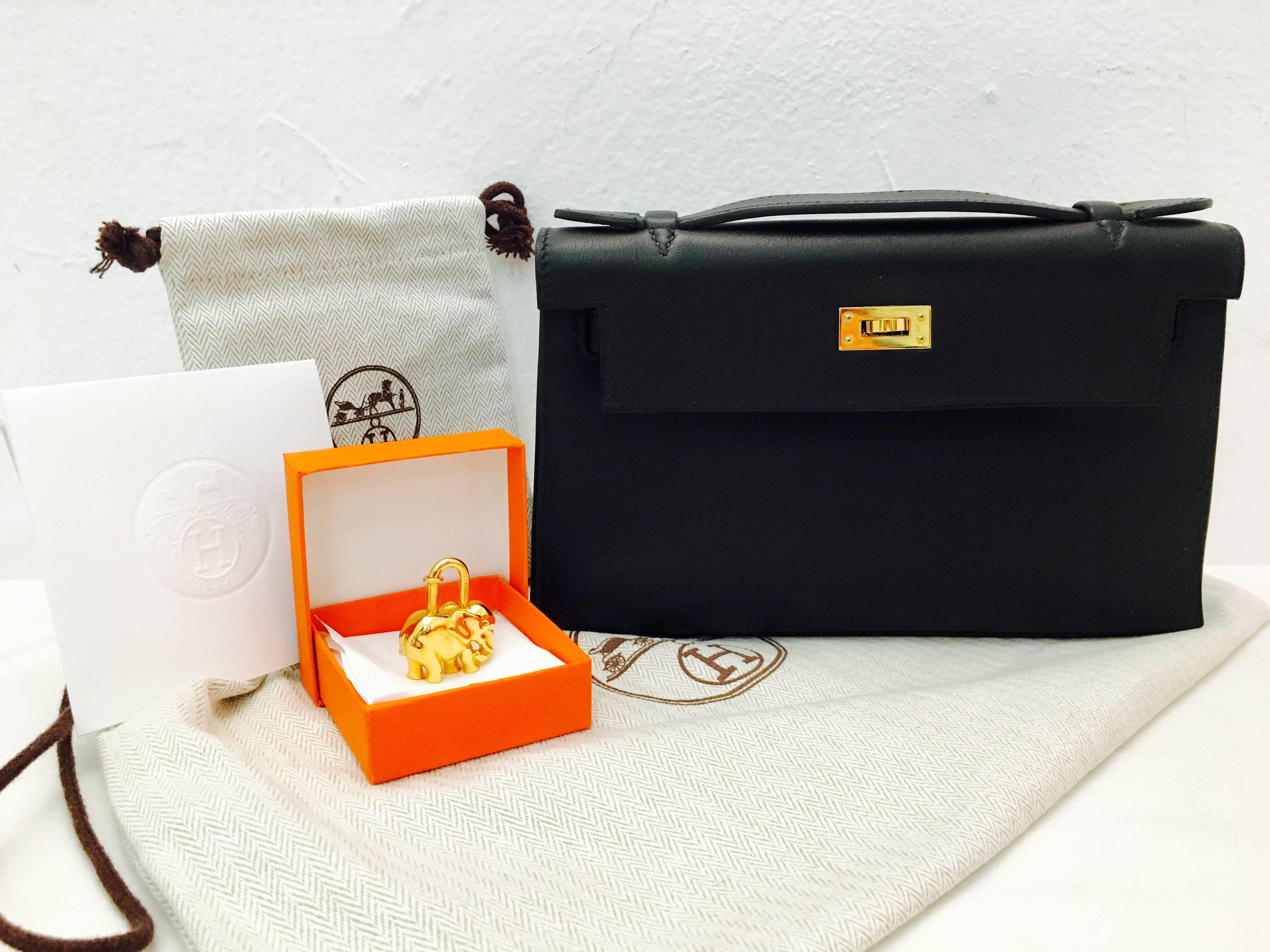 Crafted in 2007, this amazing Hermes Kelly Pochette appears to never have been carried. Made in supple Swift leather with gold hardware.  Interior features one pocket.  Hermes bags have become the most sought after in the world.  Nothing compares to