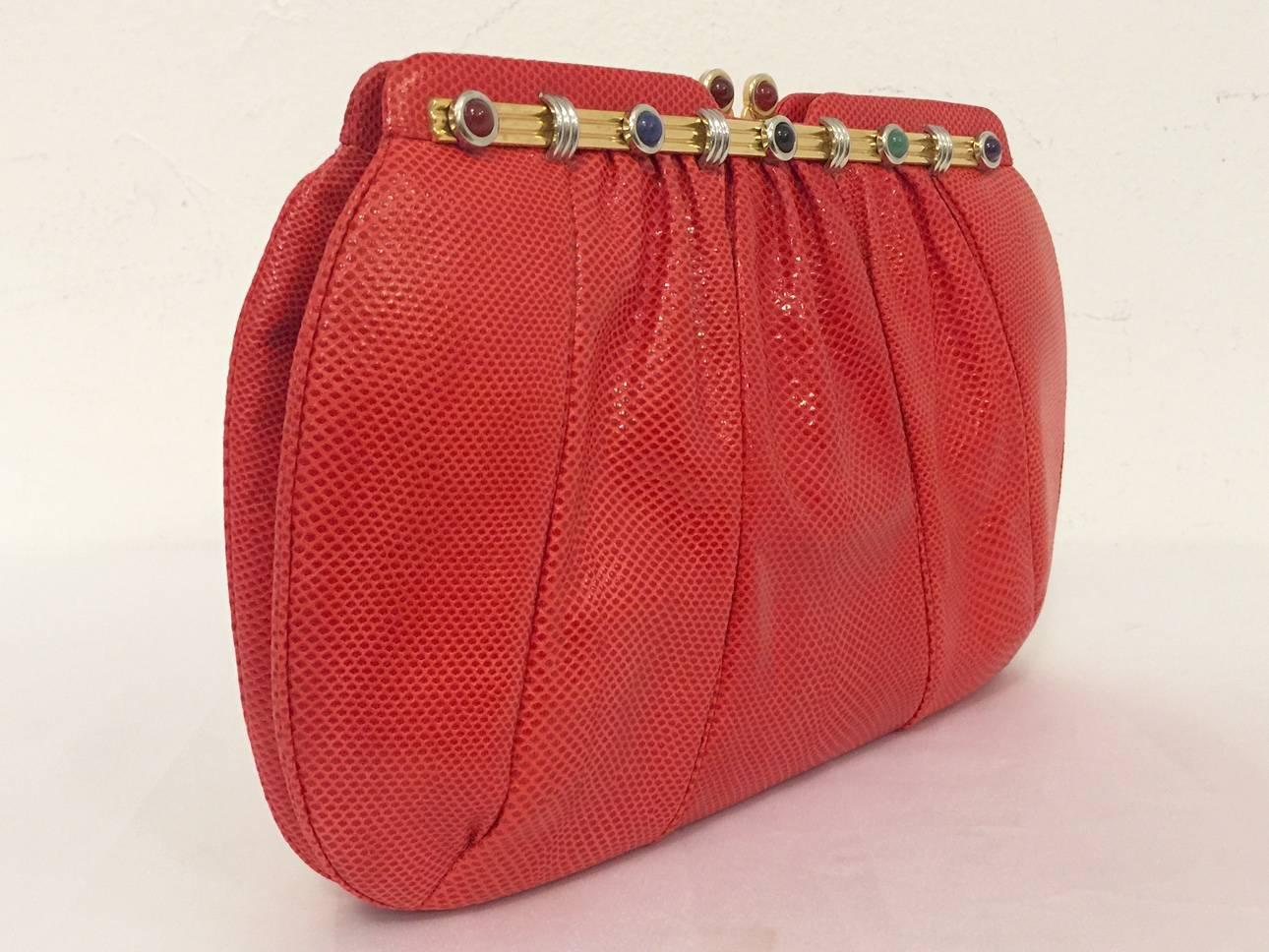 Vintage Red Lizard Evening Bag is highly desired by all collectors of Judith Leiber! Features slightly gathered, butter-soft lizard skin. Bag easily converts from clutch to shoulder bag using lizard strap with minimal effort! Forgiving gusset